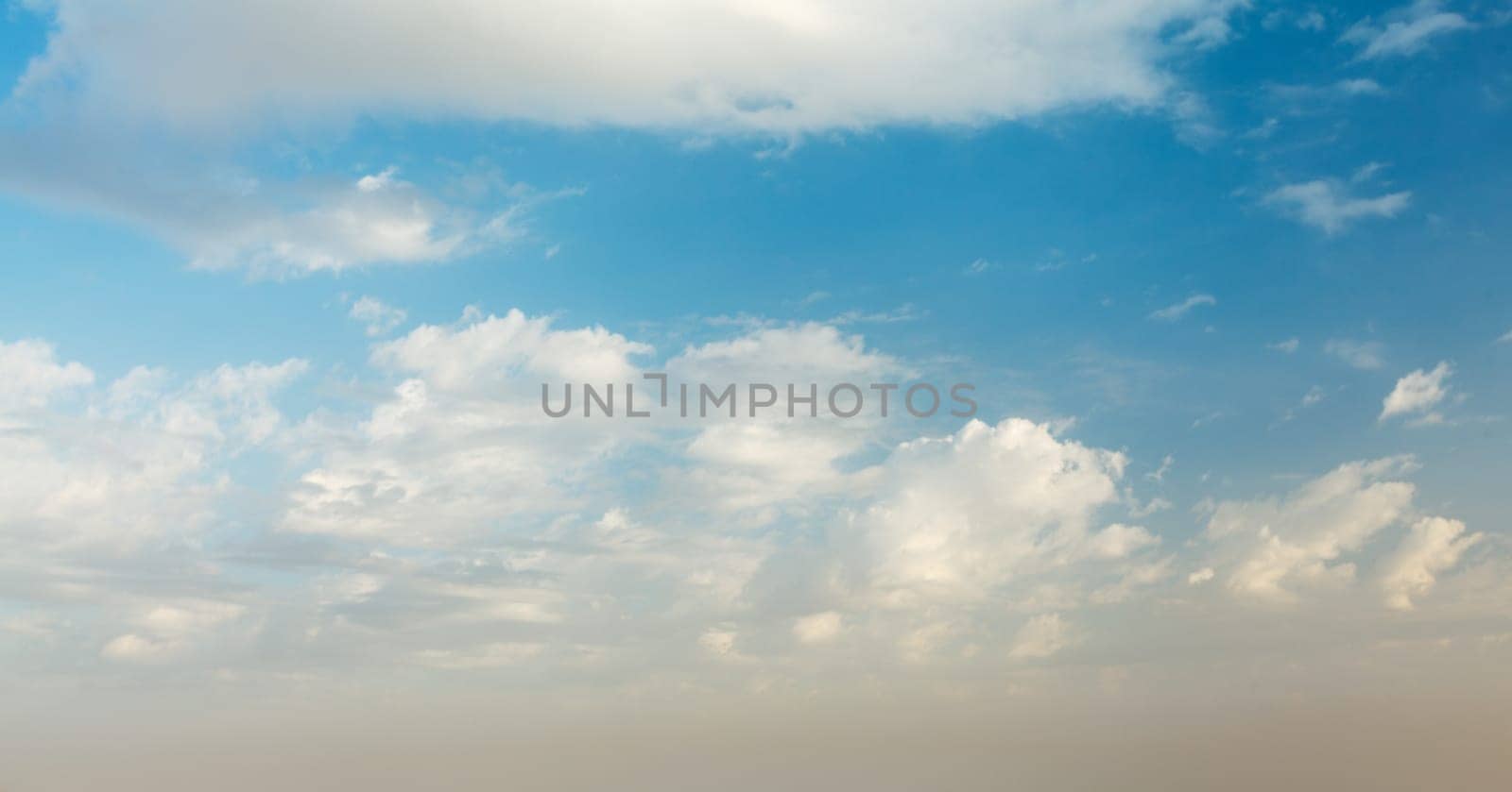 Peaceful and serene sky with clouds on sunset background