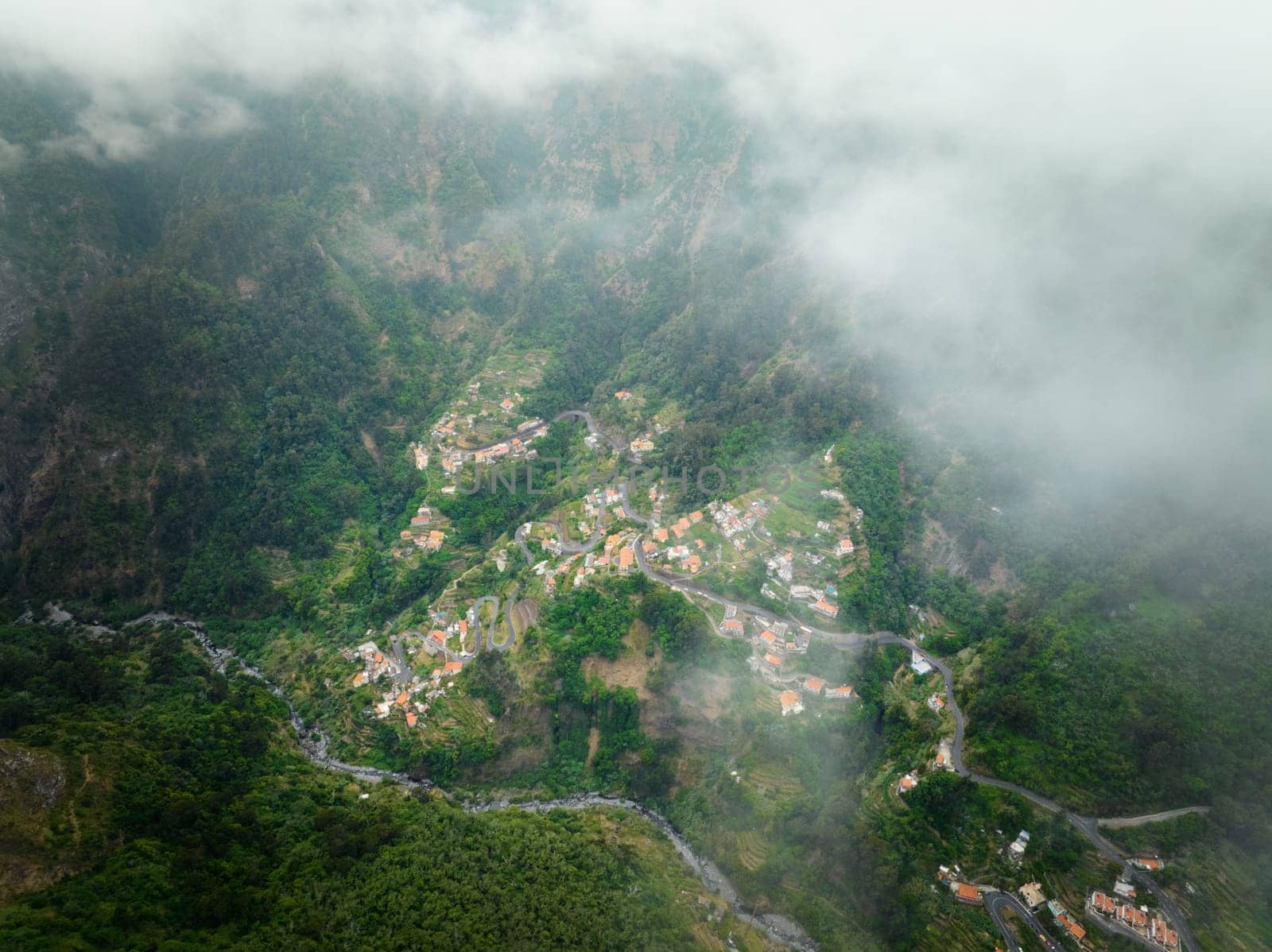 Aerial drone view of Curral das Freiras village in Valley of the Nuns from Miradouro da Eira do Serrado, Madeira island, Portugal