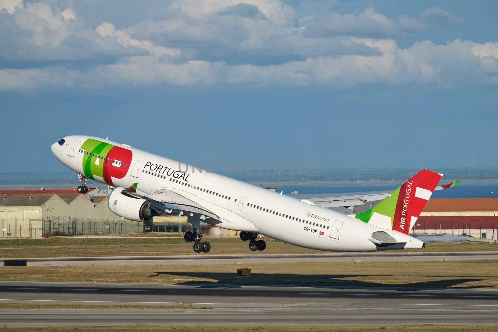 Lisbon, Portugal - September 2, 2023: TAP Air Portugal Airbus A330-941 passenger plane take off in Humberto Delgado Airport in Lisbon