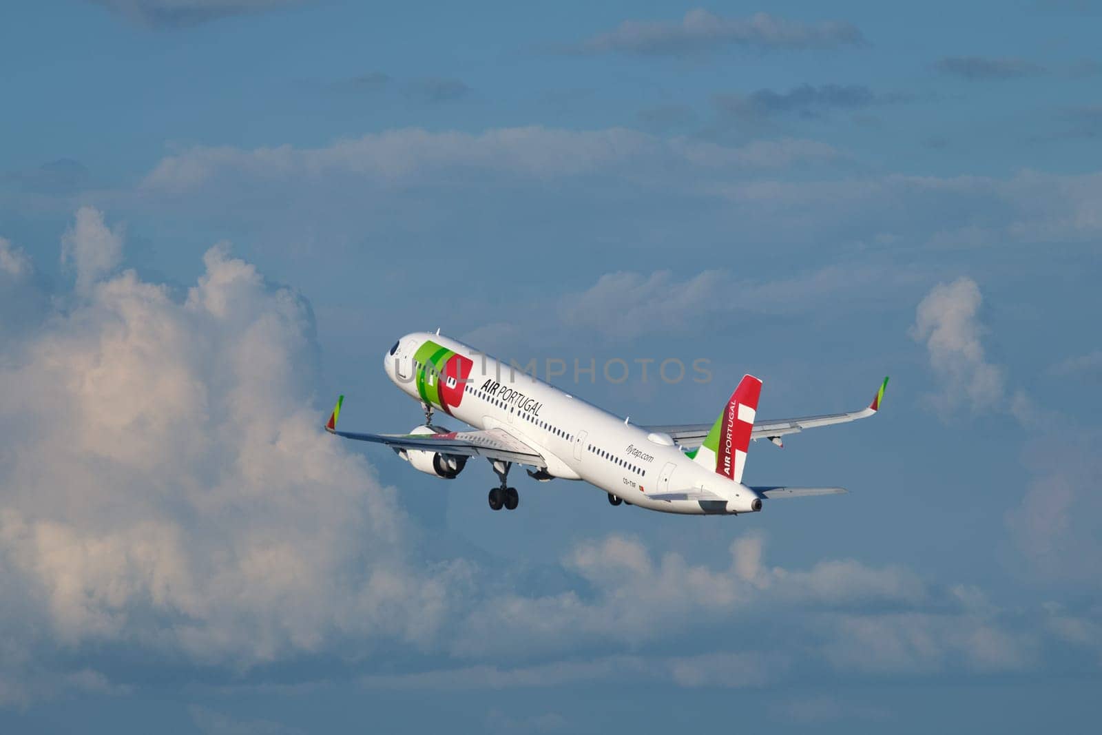Lisbon, Portugal - September 2, 2023: TAP Air Portugal Airbus A321-251NX passenger plane in sky with clouds after take off in Humberto Delgado Airport in Lisbon