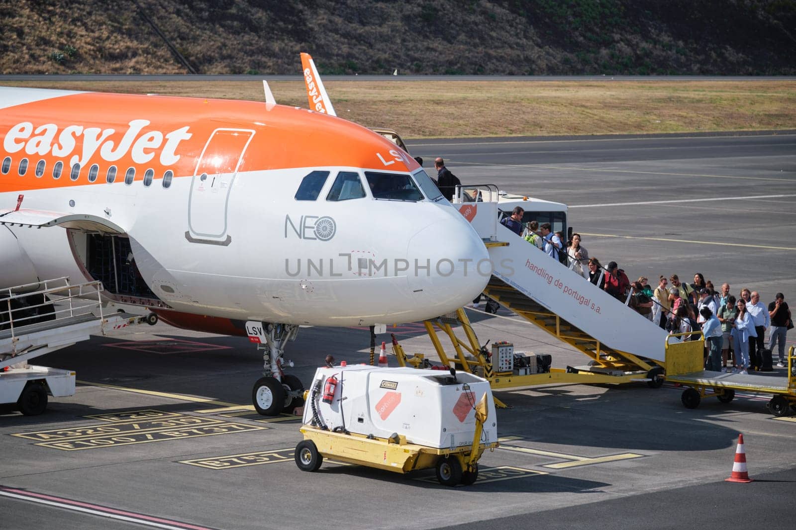 Lisbon, Portugal - September 2, 2023: Passenger boarding easyJet Airbus A321-251N passenger plane in Cristiano Ronaldo Airport in Funchal, Madeira Island