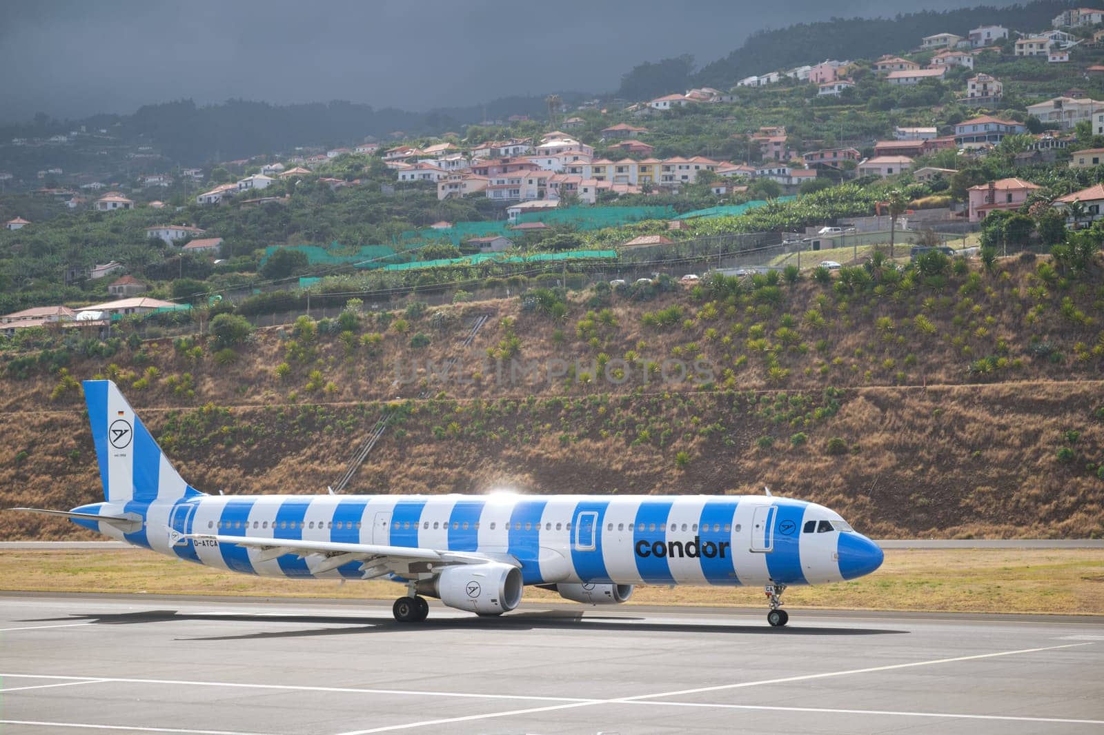 Lisbon, Portugal - September 2, 2023: Condor Airbus A321-211 passenger plane taxi on runway in Cristiano Ronaldo Airport on Madeira island
