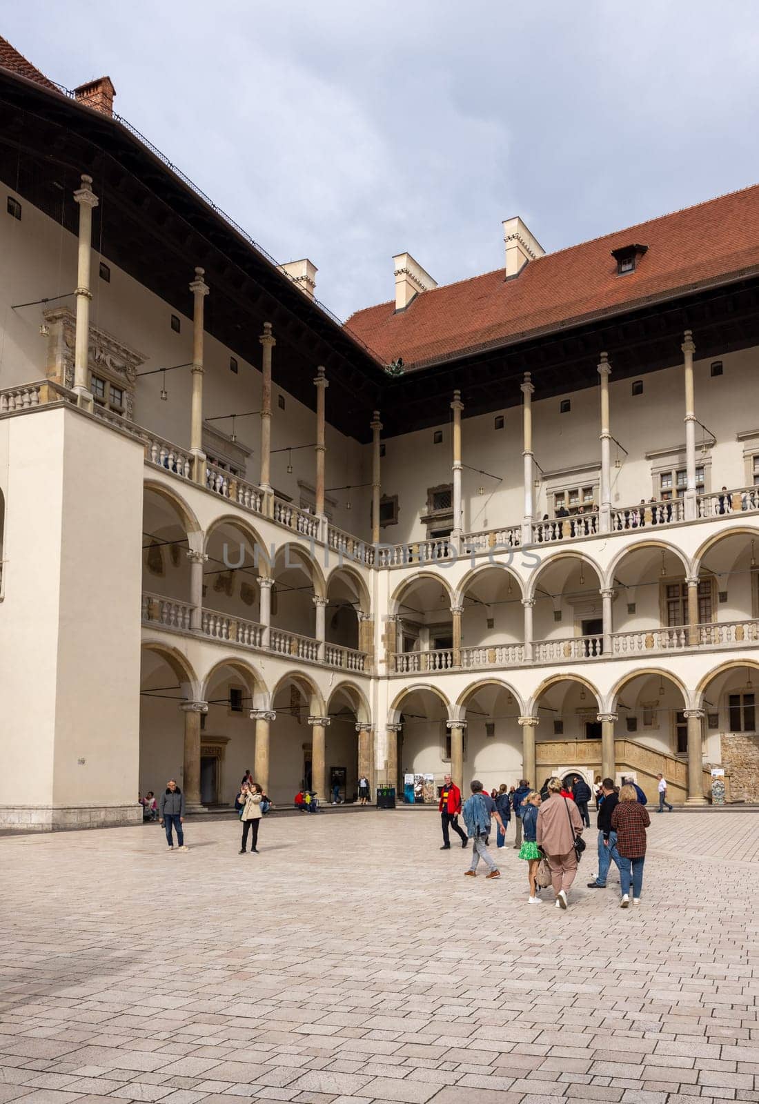 Cracow, Poland - October 1, 2023: The arcaded Renaissance-style courtyard at Wawel Royal Castle on Wawel Hill