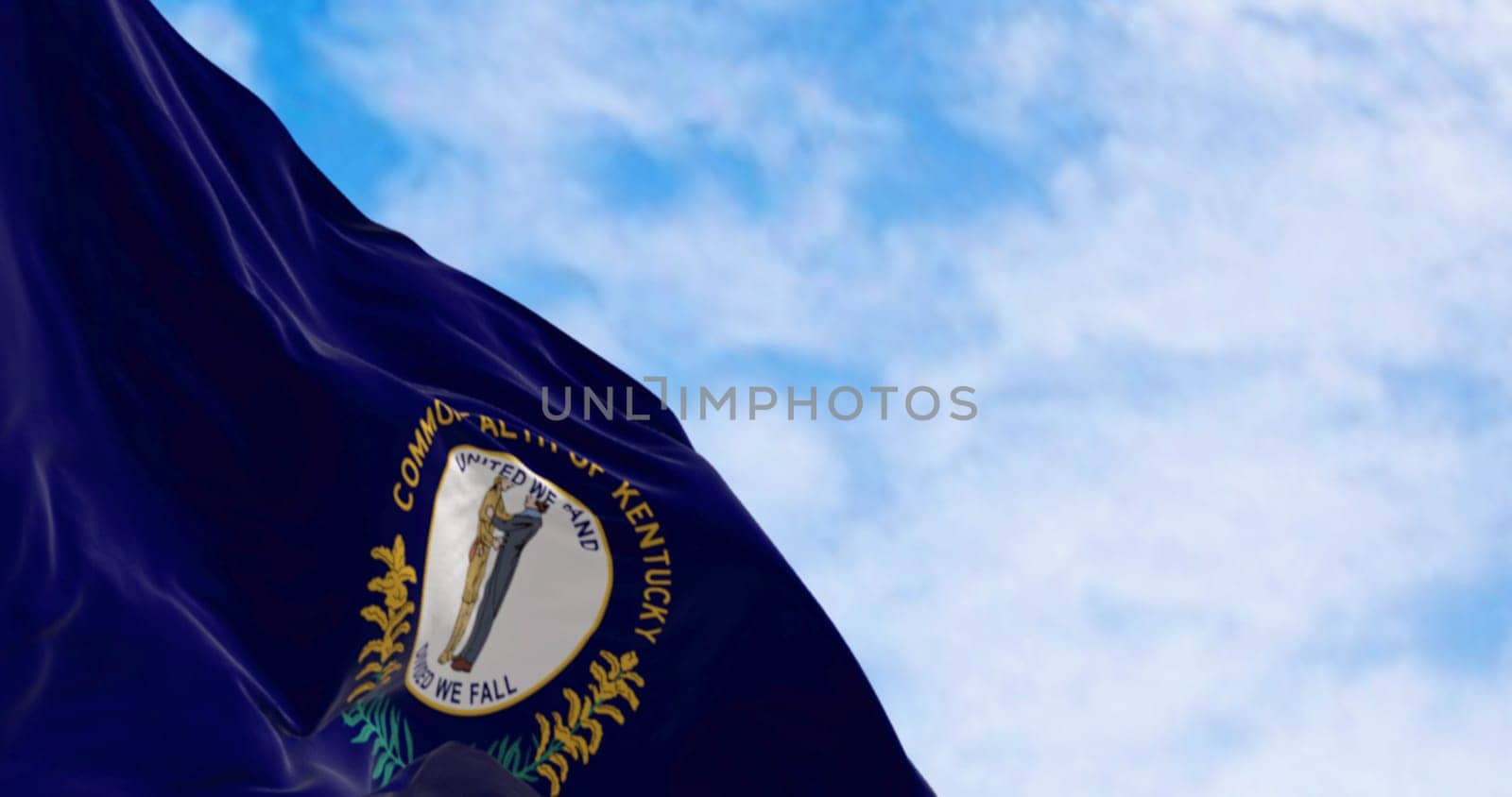 The US state flag of Kentucky waving. Kentucky flag features state seal: two men embracing, motto United We Stand, Divided We Fall above. 3d illustration render. Fluttering fabric