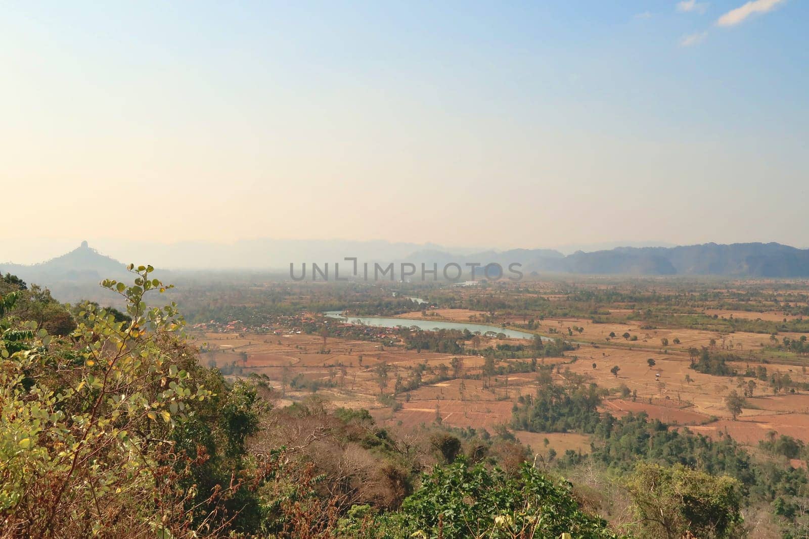 Spectacular view onto Ban Namsanam village, town and the landscape that surrounds it, close to Ba Hin, another small village, town on the Thakhek Motorbike Loop, Laos 2023