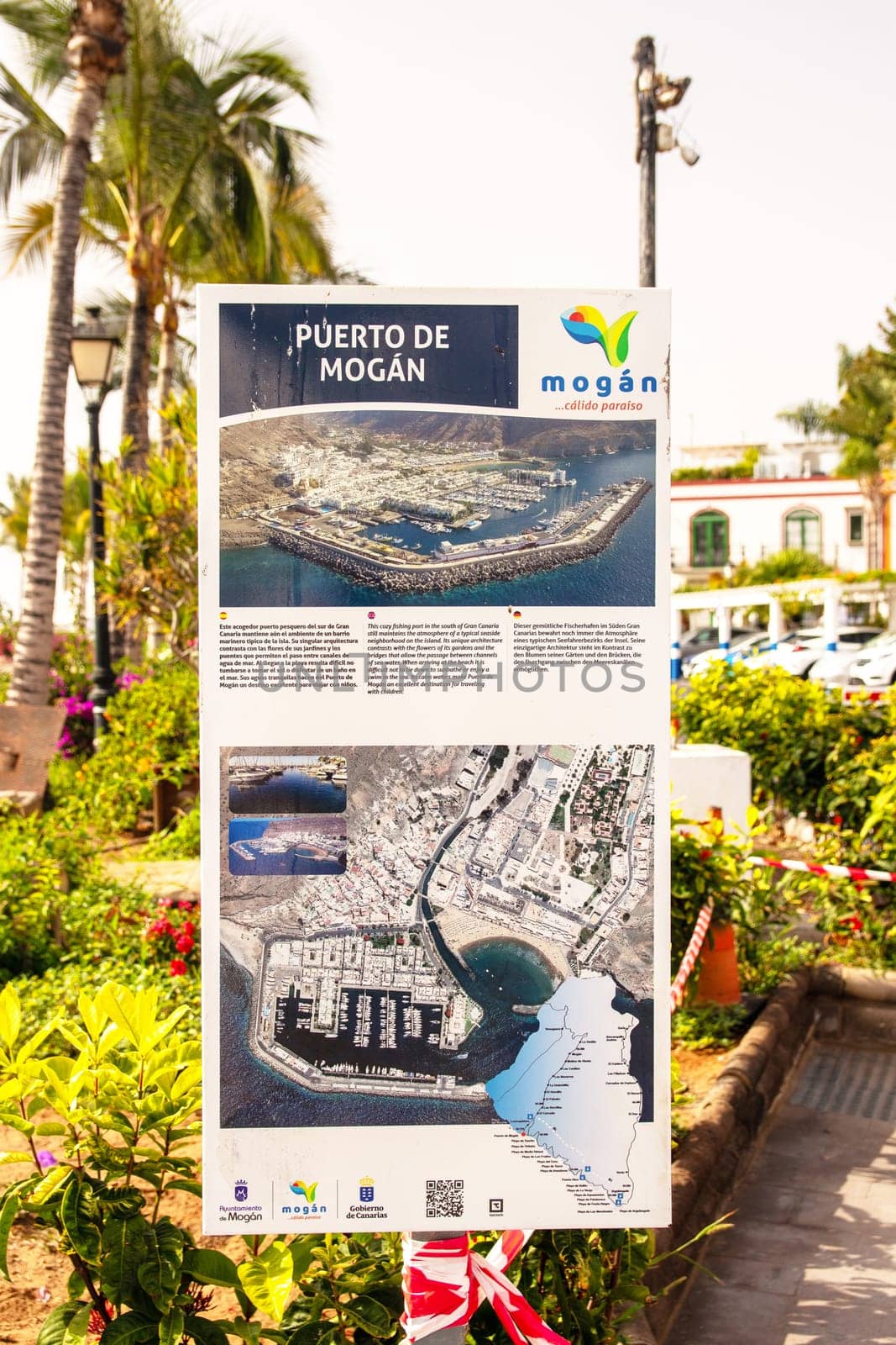 Gran Canaria, Spain, Jul 18, 2024. An information sign about Puerto de Mogan, also called little Venice, with a small fishing harbour, romantic alleys and beautiful architecture.
