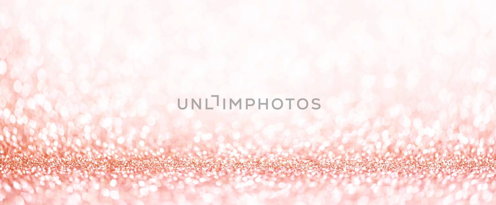 Light pink bokeh background. Pastel blur glitter abstract wallpaper. Girly and classy design element for wedding celebration.
