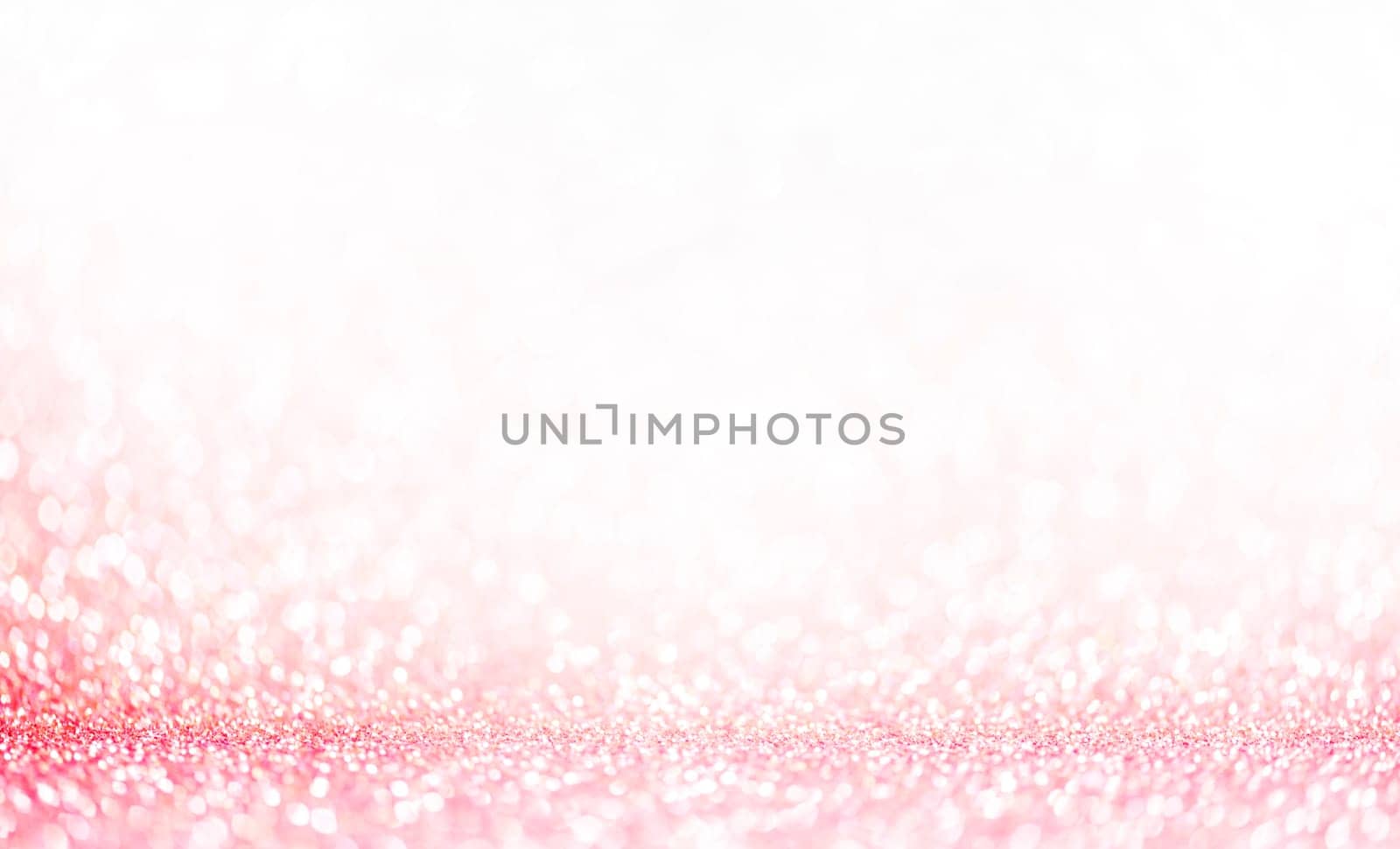 Light pink bokeh background. Pastel blur glitter abstract wallpaper. Girly and classy design element for wedding celebration.