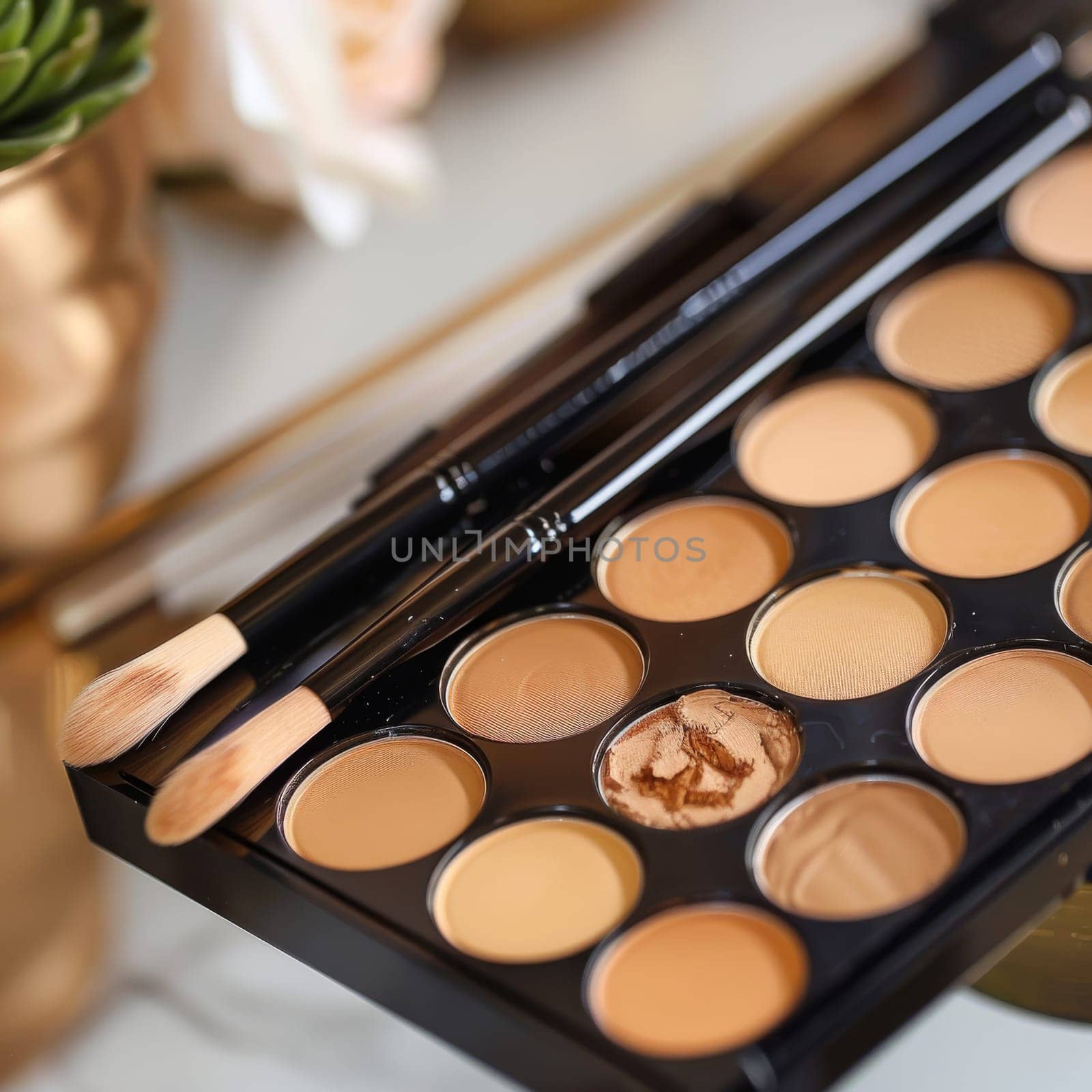 Concealer palette for covering blemishes and dark circles.