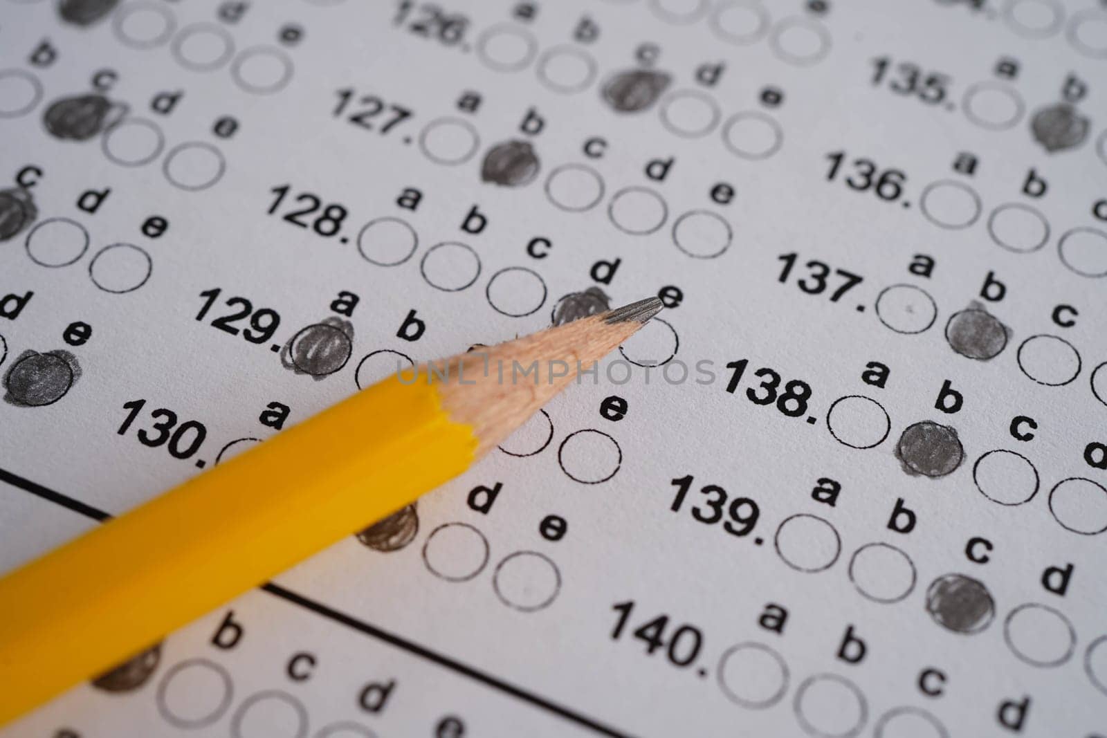 Answer sheets with pencil drawing fill to select choice, education concept.