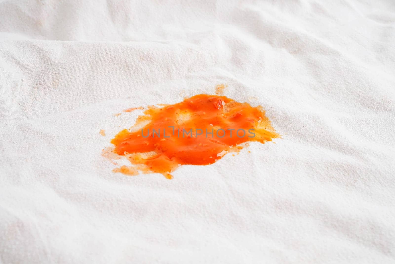 Dirty tomato sauce stain or ketchup on cloth to wash with washing powder, cleaning housework.