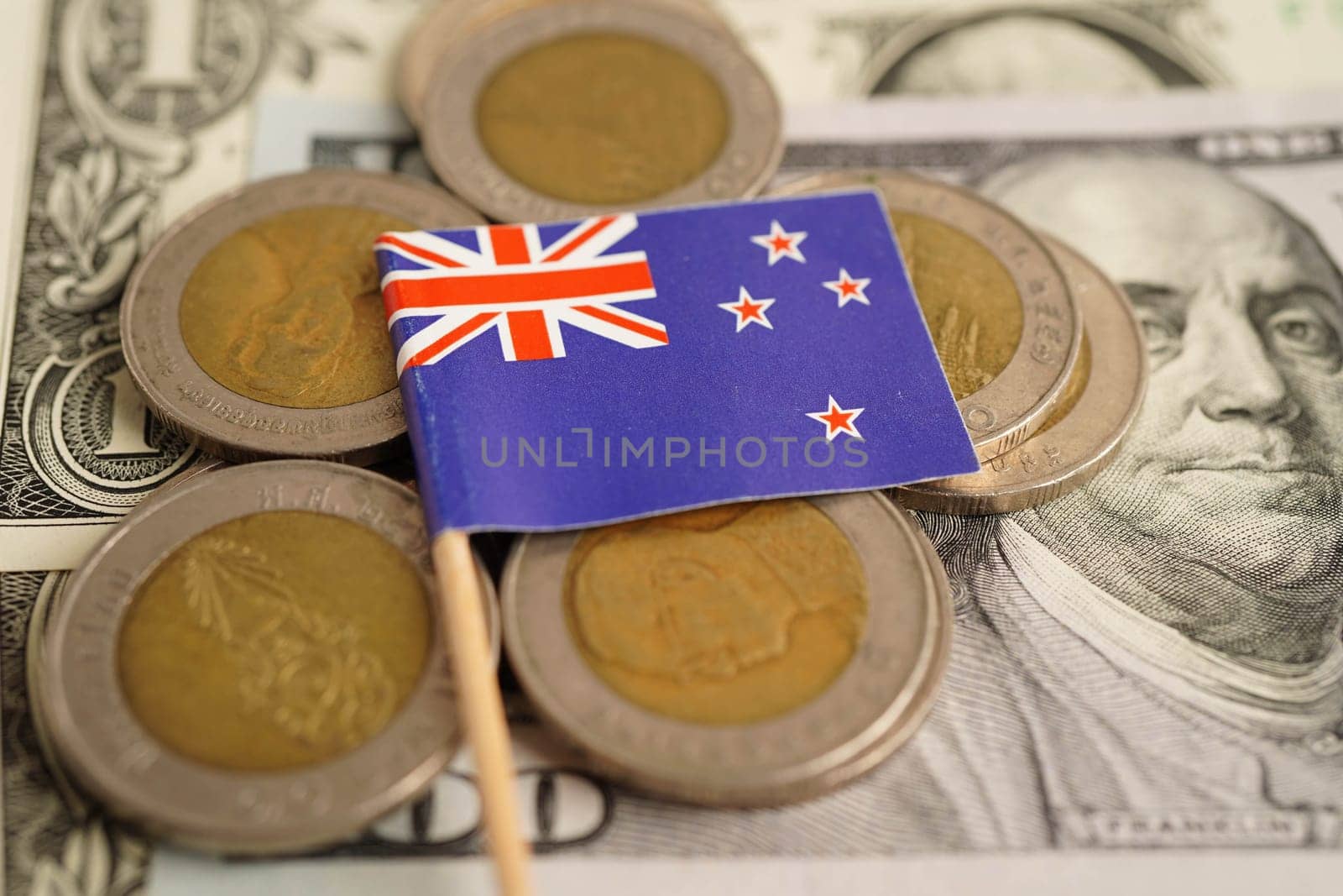 Australian flag on coin and banknote money, finance trading investment business currency concept.