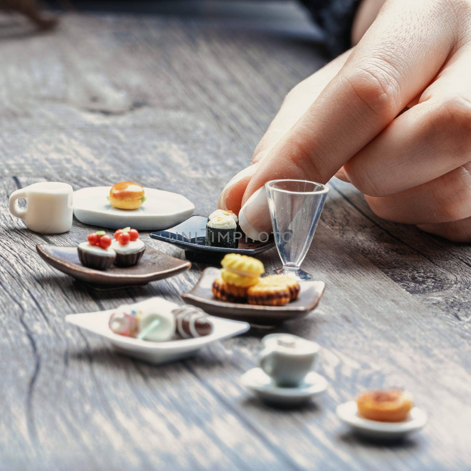 Small servings of sushi, pastries, and coffee emphasize how correct portions feel insubstantial despite being nutritionally balanced. They remain tempting but leave one wanting more