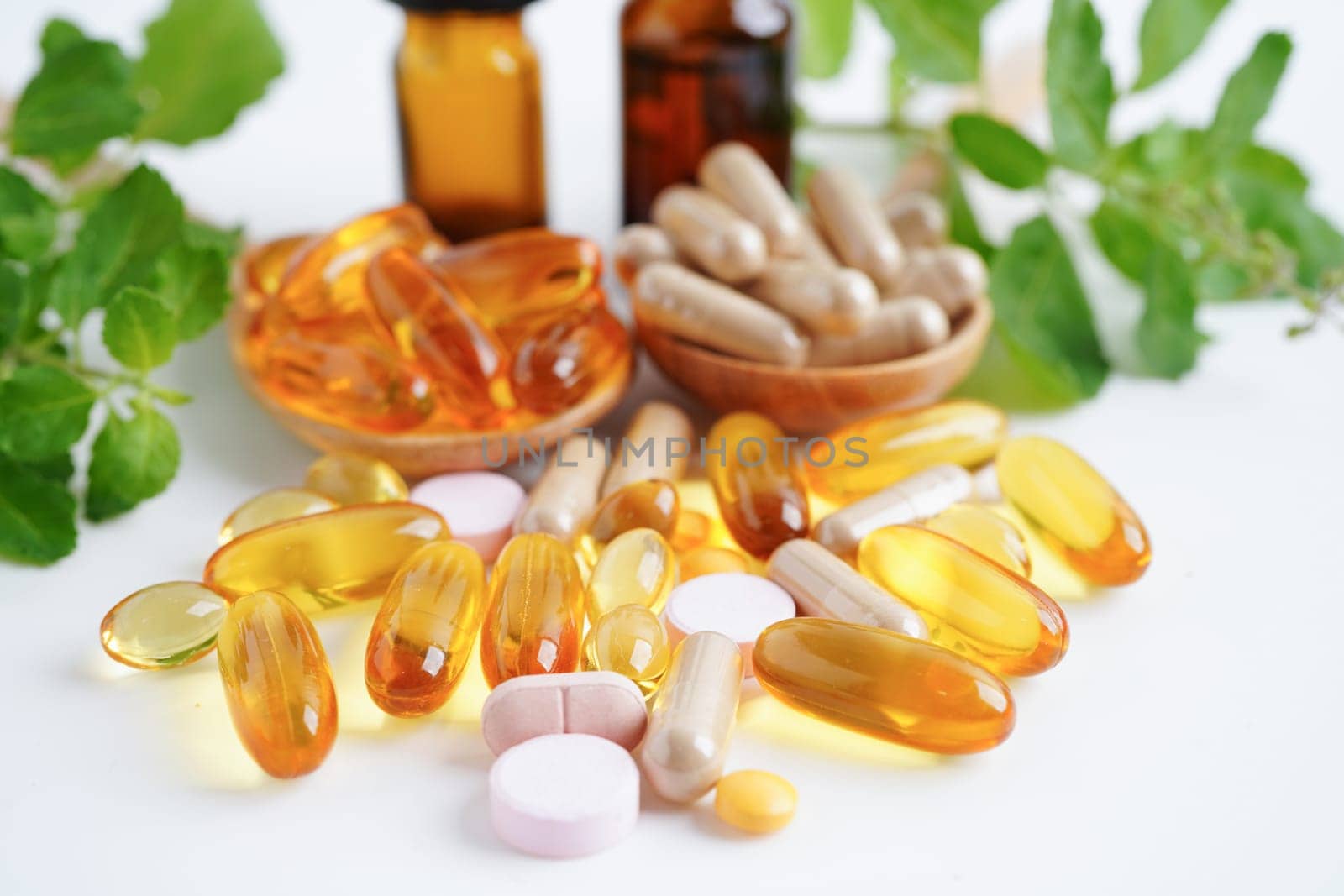 Alternative medicine herbal organic capsule with vitamin E omega 3 fish oil, mineral, drug with herbs leaf natural supplements for healthy good life.