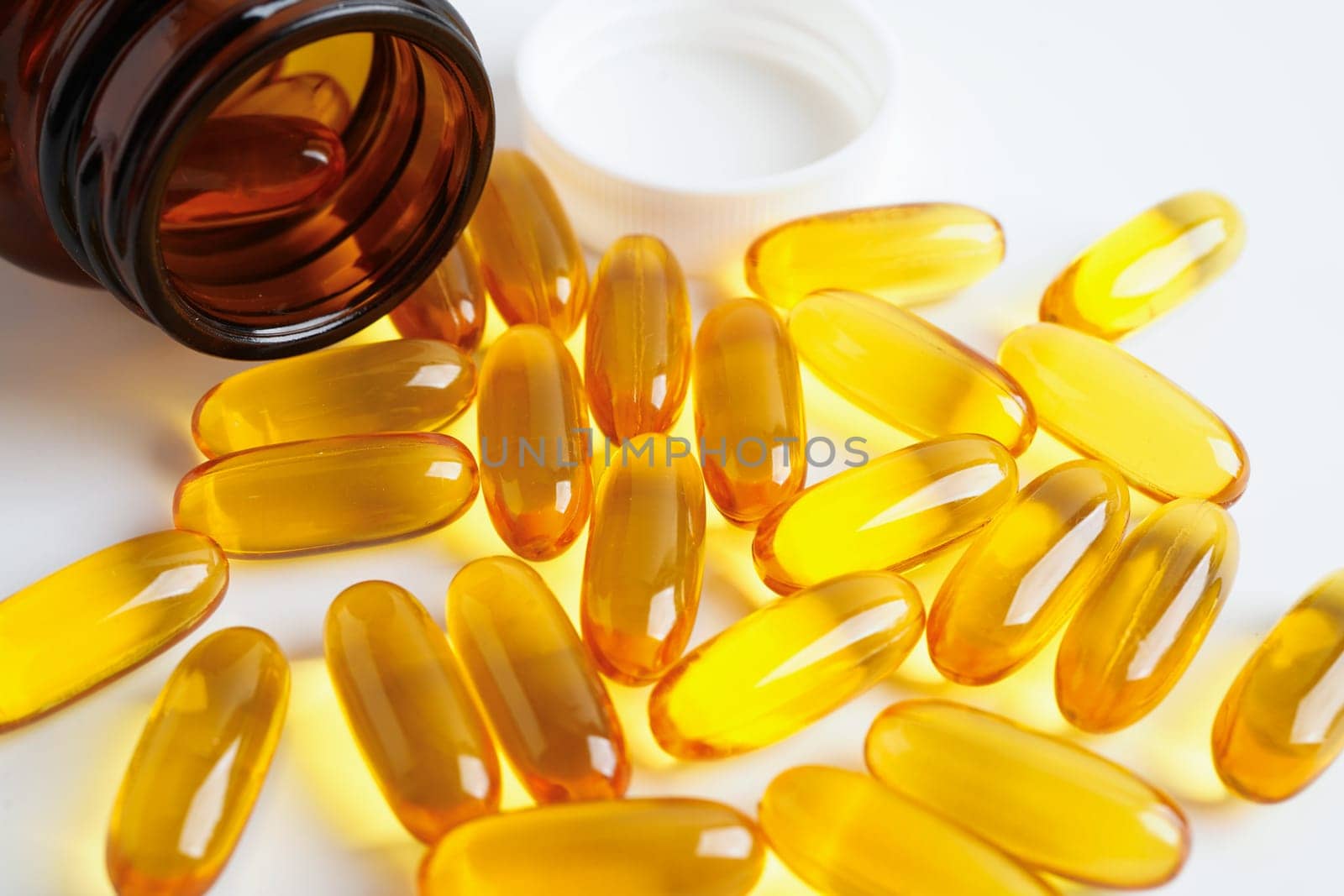 Fish oil or Cod liver oil gel in capsules with omega 3 vitamins, supplementary healthy food