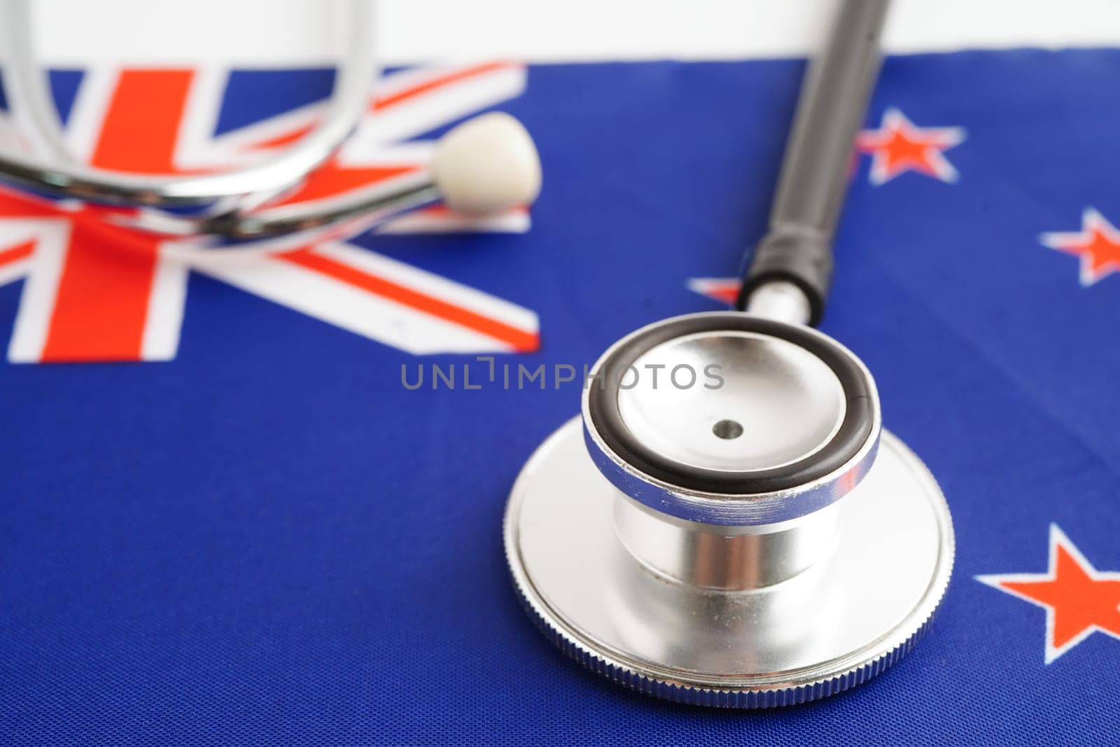 New Zealand flag with black stethoscope, Business and finance concept.