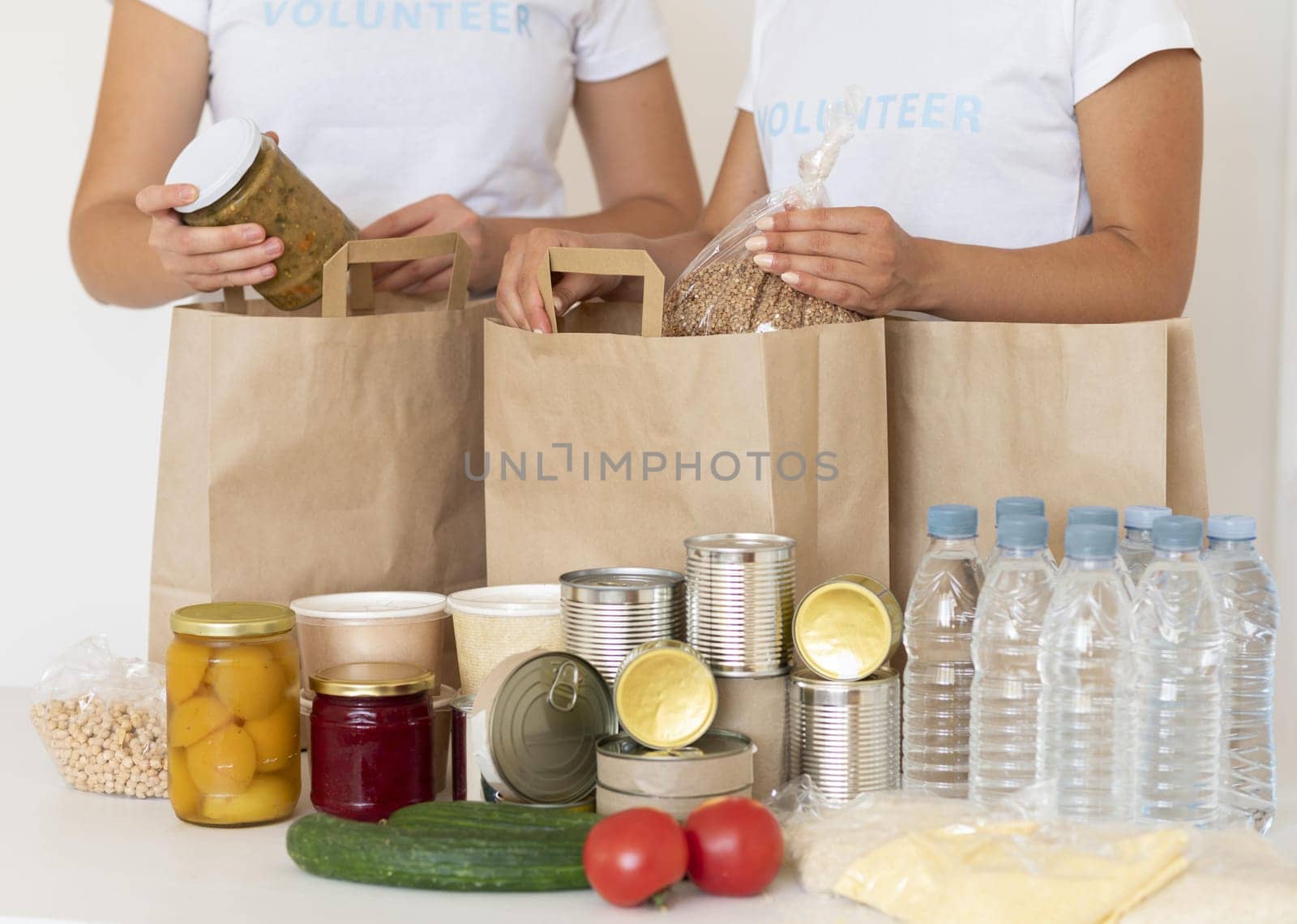 volunteers with bags food water donation. Resolution and high quality beautiful photo
