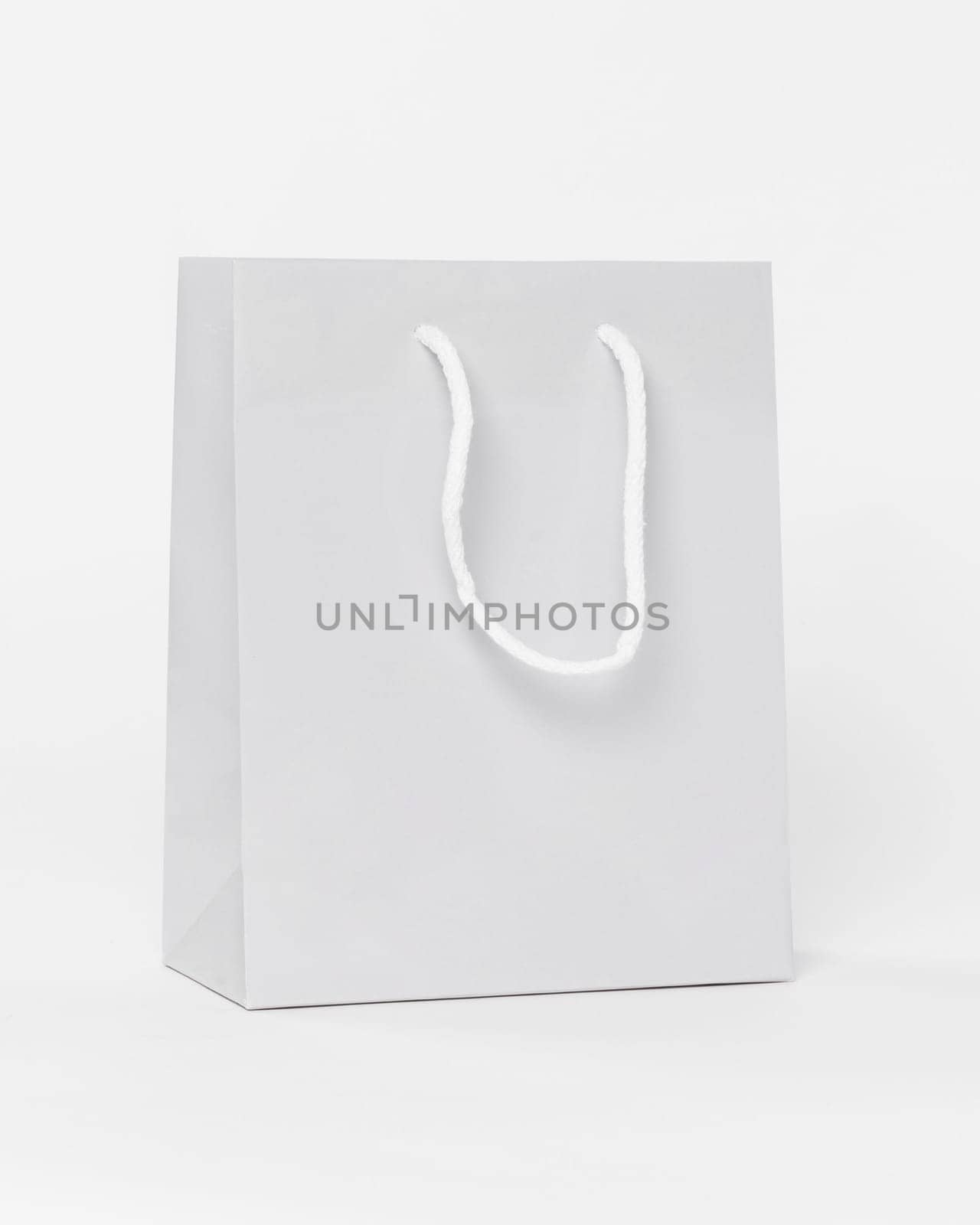 white paper shopping bag with handles. Resolution and high quality beautiful photo