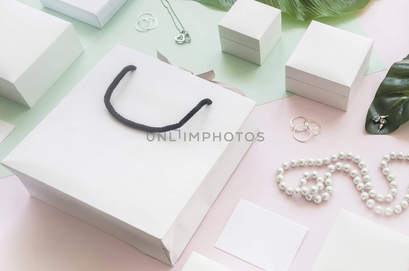 white shopping bag gift boxes with jewelry colored background. Resolution and high quality beautiful photo