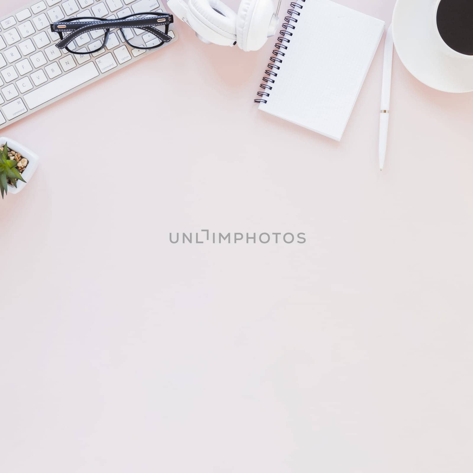 workplace with various gadgets notebook coffee cup pink background. Resolution and high quality beautiful photo