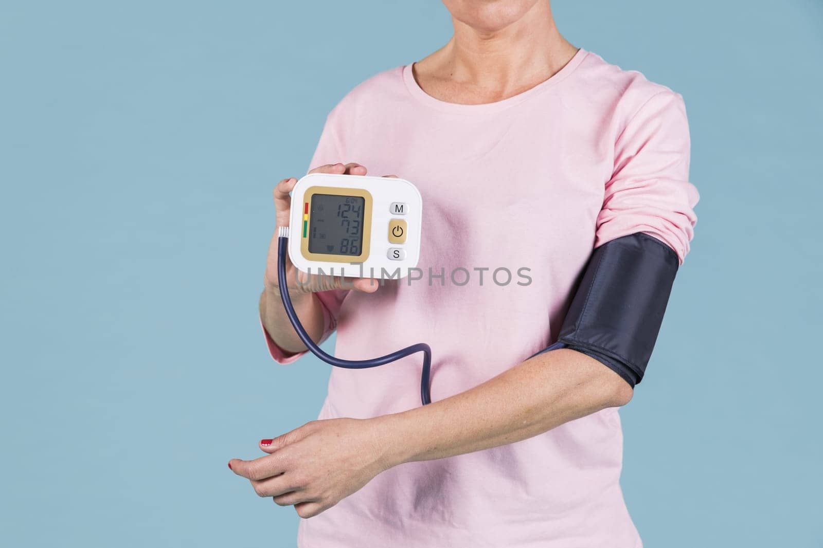 woman showing results blood pressure electric tonometer screen. Resolution and high quality beautiful photo
