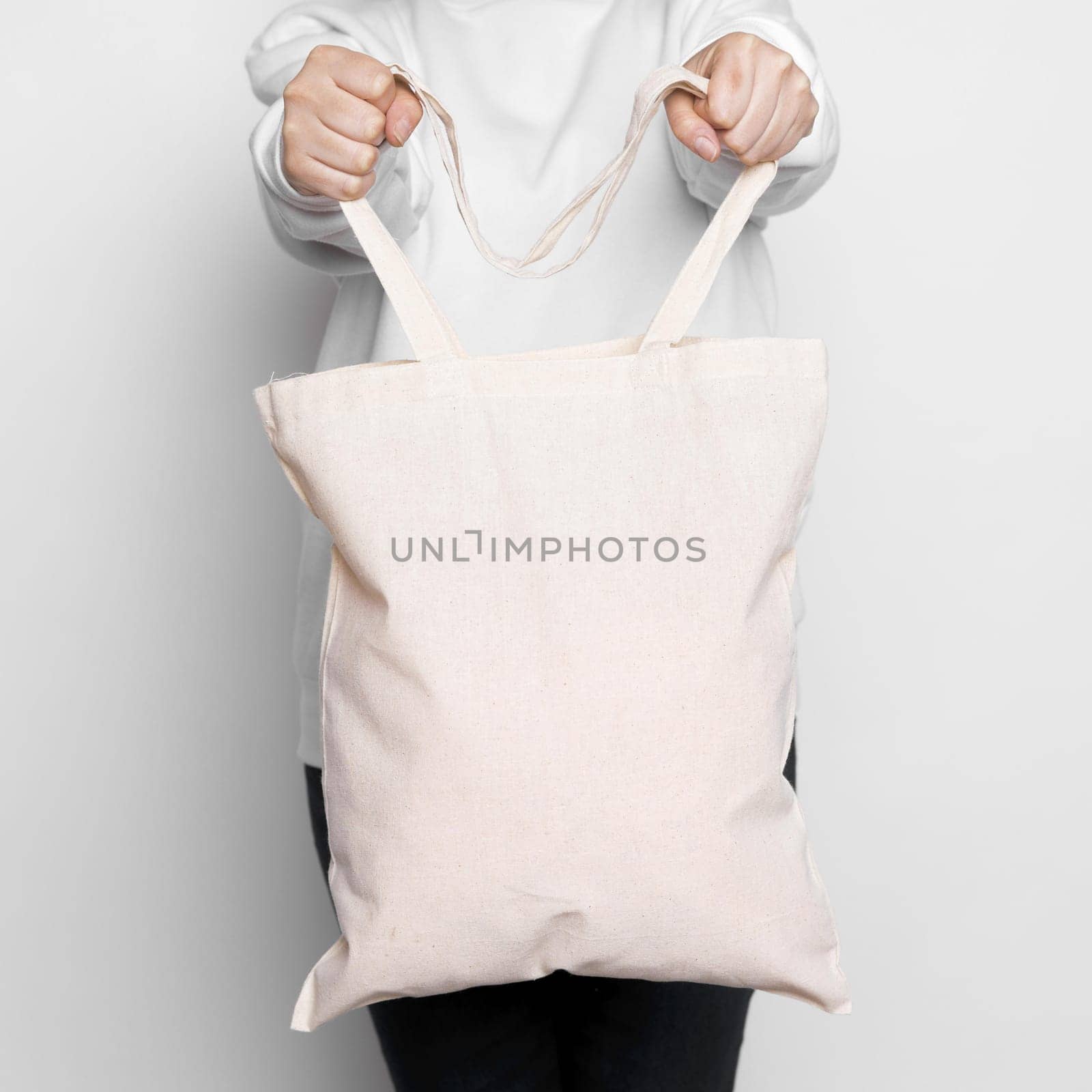 woman standing and carrying a tote bag. Resolution and high quality beautiful photo