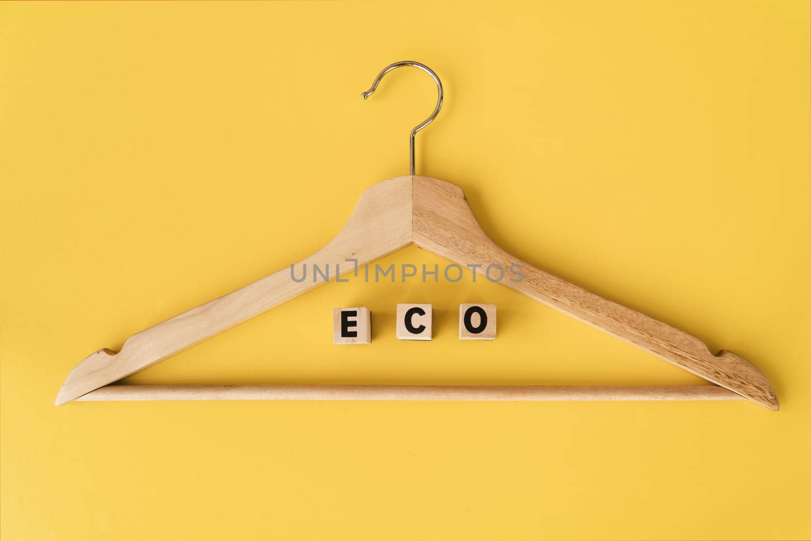 top view wooden hanger with yellow background 1. Resolution and high quality beautiful photo