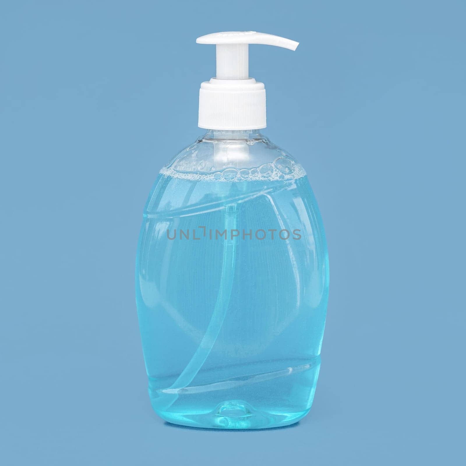transparent bottle liquid soap blue background. Resolution and high quality beautiful photo