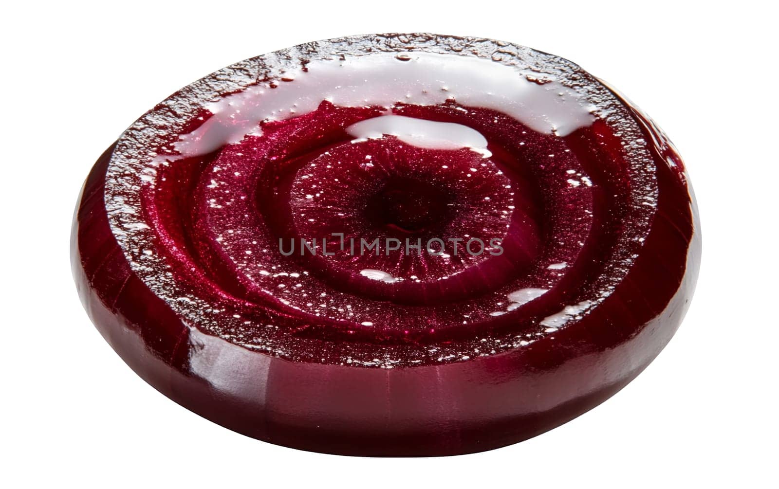 Close up of a glistening red onion slice showing its intricate layers and vibrant color. Isolated on white background.