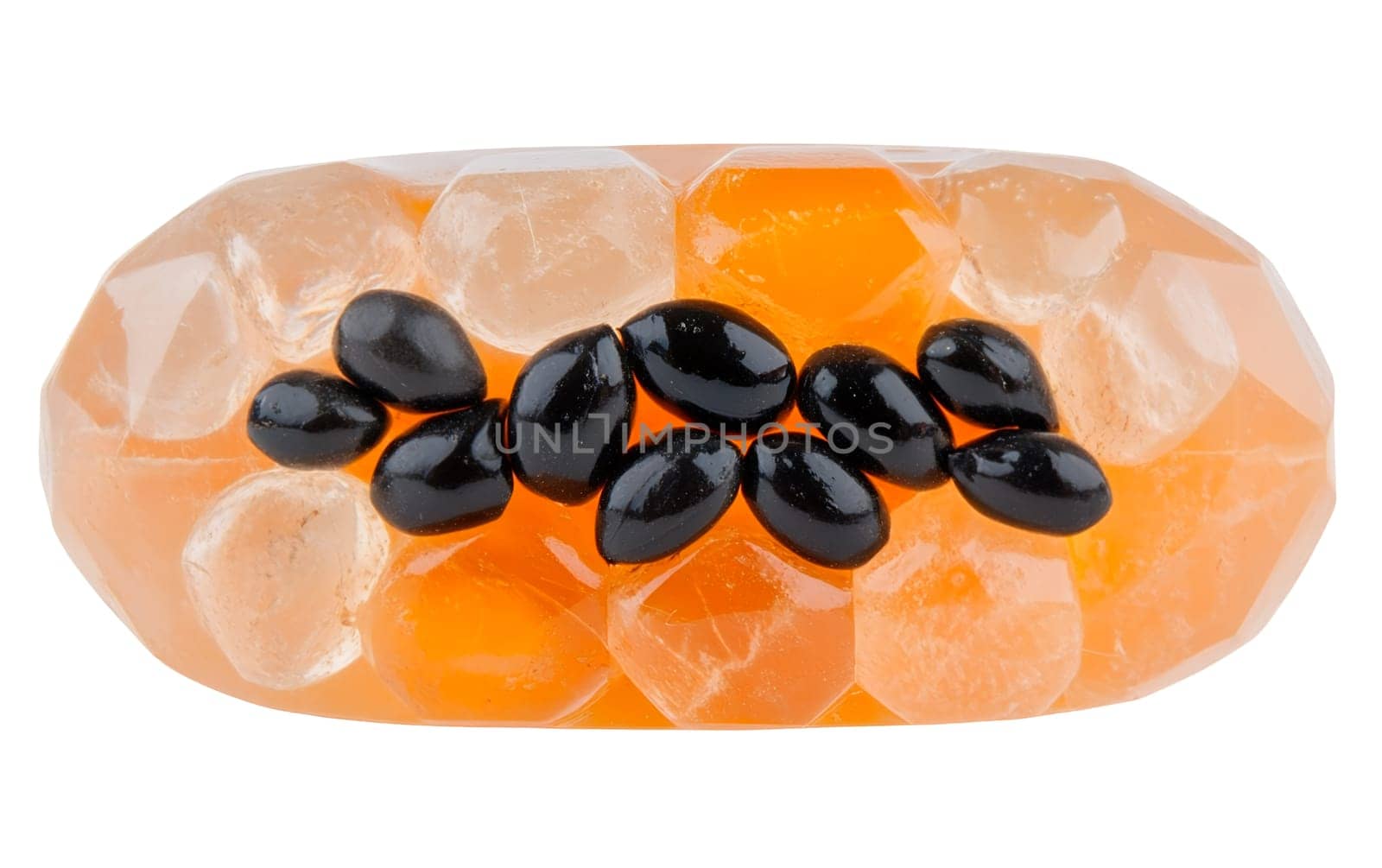 A piece of artistic papaya jelly embedded with white seeds, highlighted on a white background, capturing its unique texture. Isolated on white background.