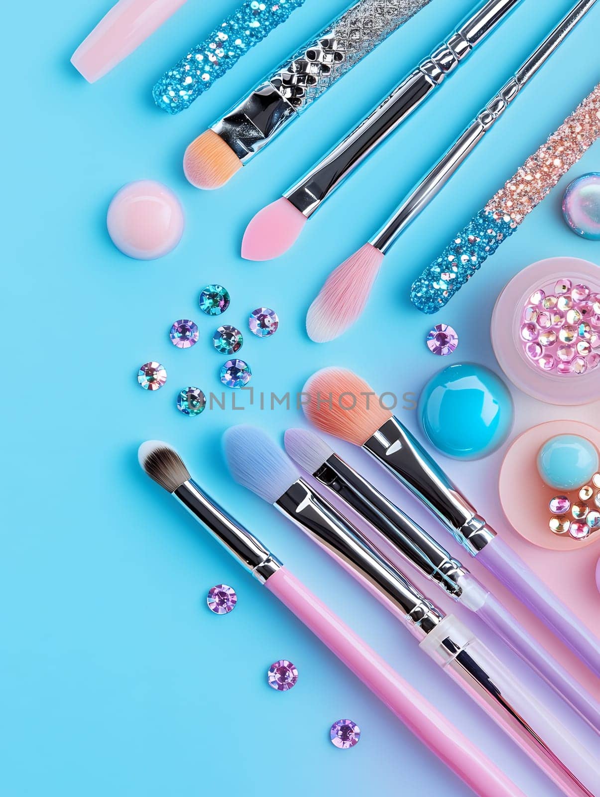 Vibrant makeup brushes and sparkling accessories on a bright blue background.