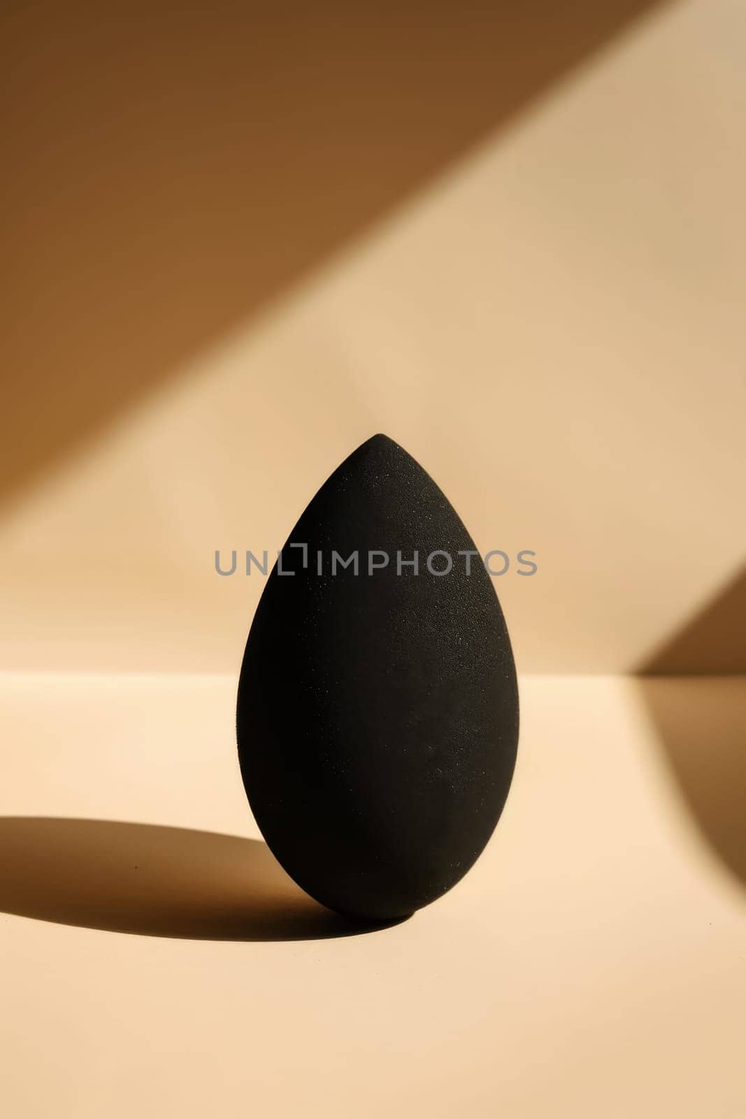 Graceful silhouette of a makeup sponge blending seamlessly.