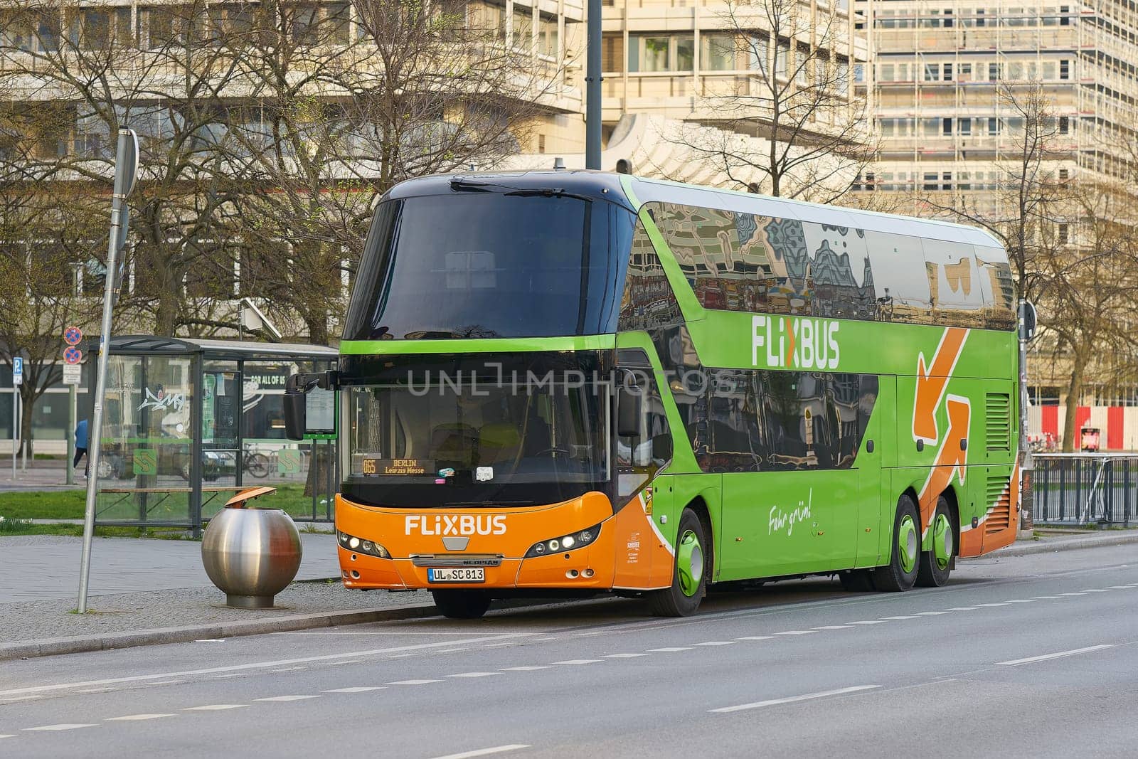 Bus of the FlixBus brand of the German transport company Flix, provider of bus travel within Europe in the city center of Berlin in Germany by heiko119