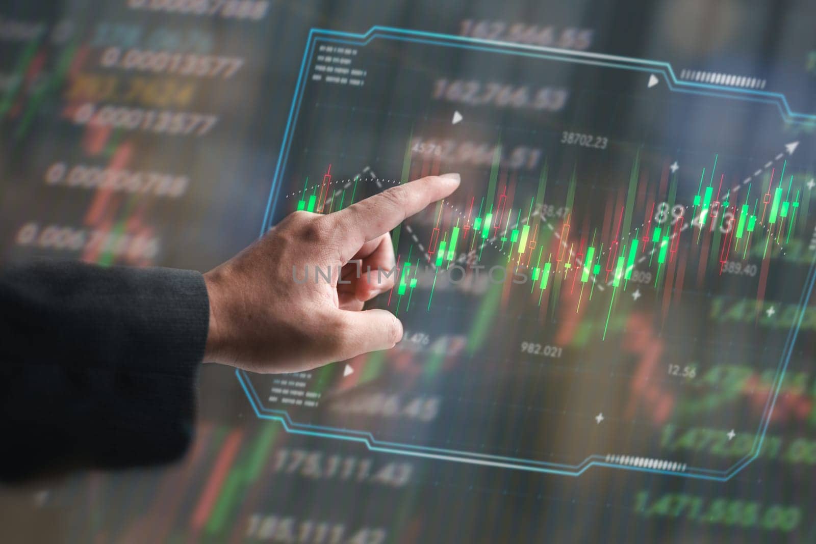 Hand pointing at financial data hologram, stock market trading graph. Symbolizes investment and market analysis. Ideal for financial services, trading platforms, and economic reports.