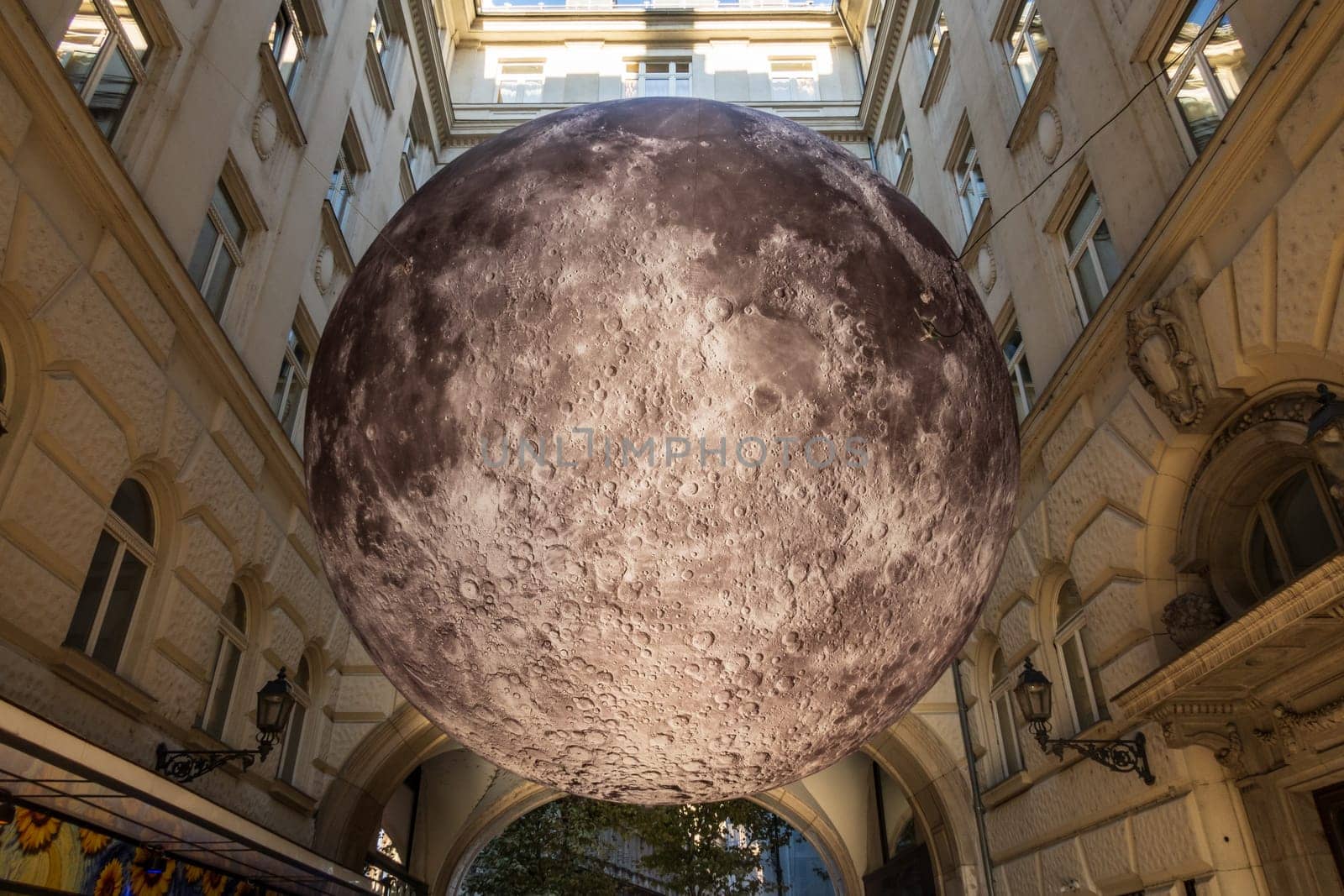 Budapest, Hungary - September 29 2024: Detailed replica of the moon's entire surface. A striking installation, floating 3.5 meters high in Piarista köz, near Elizabeth Bridge in Budapest