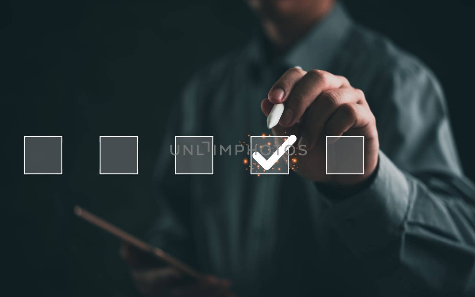 Hand of businessman marking checkbox on a digital interface. Depicts decision-making and task management. Ideal for business planning, evaluation, and survey topics. Modern, professional style.