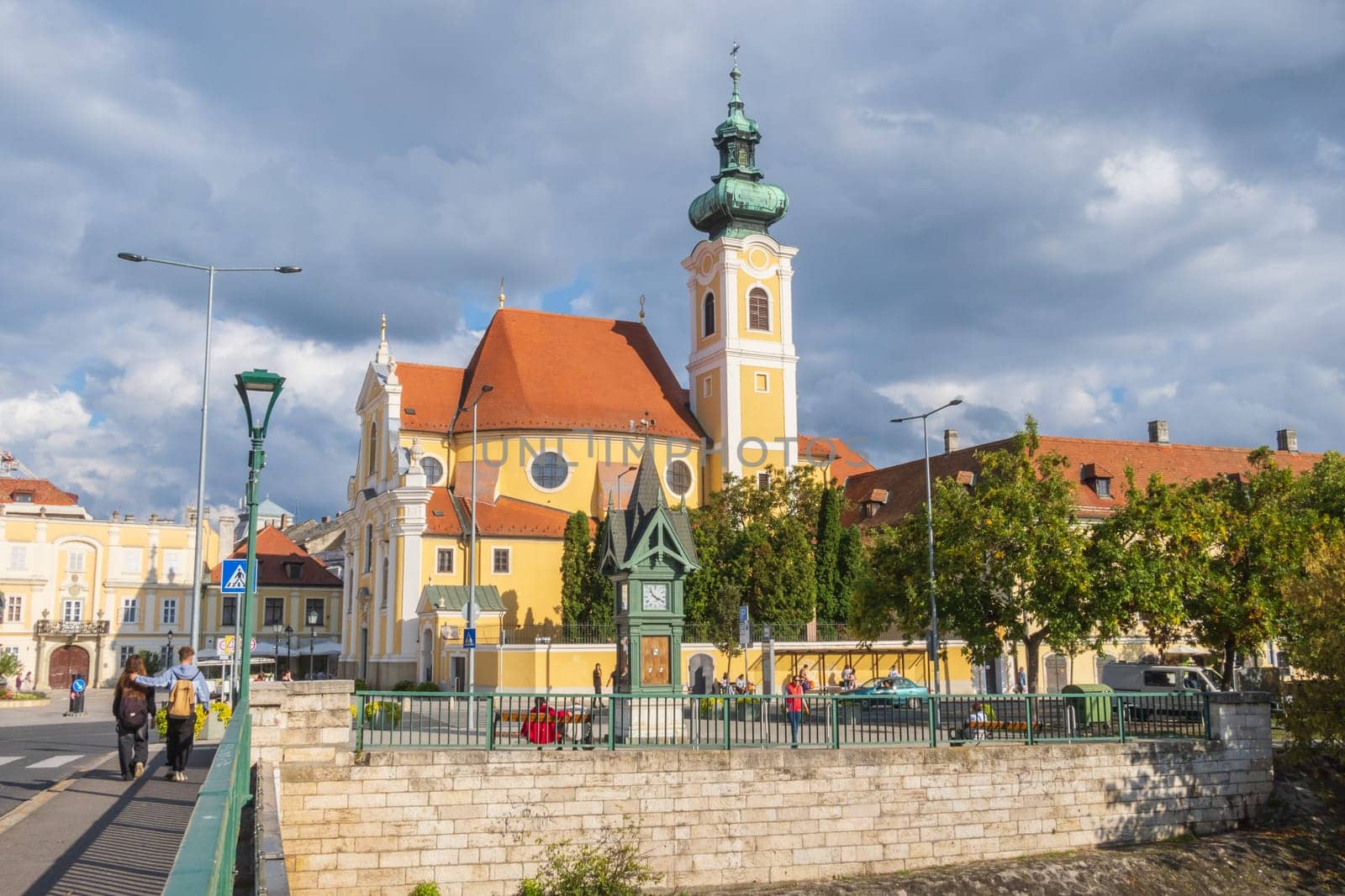 Gyor, Hungary- September 25 2024: The Carmelite church seen from the bridge in the downtown of Gyor, Hungary