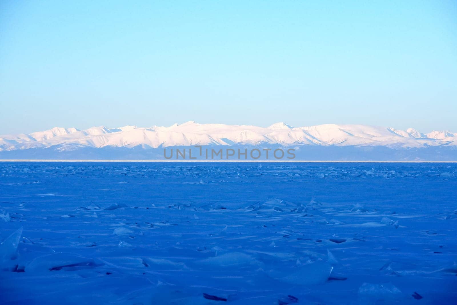 The shore of Lake Baikal in winter. Snow and ice on the baikal.