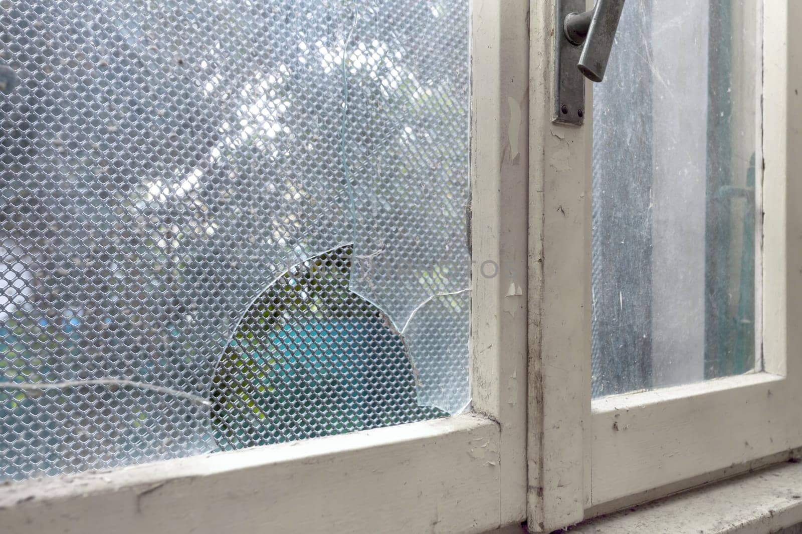 Old abandoned building. Glass of old windows broken. Abandoned house.