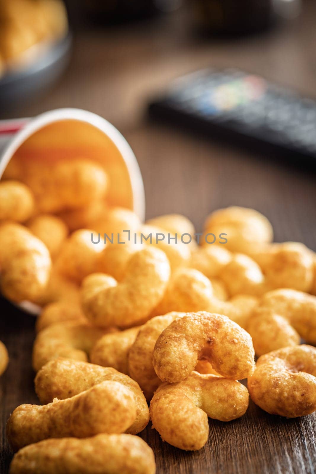 Puffed crispy Peanut flips on a wooden table.