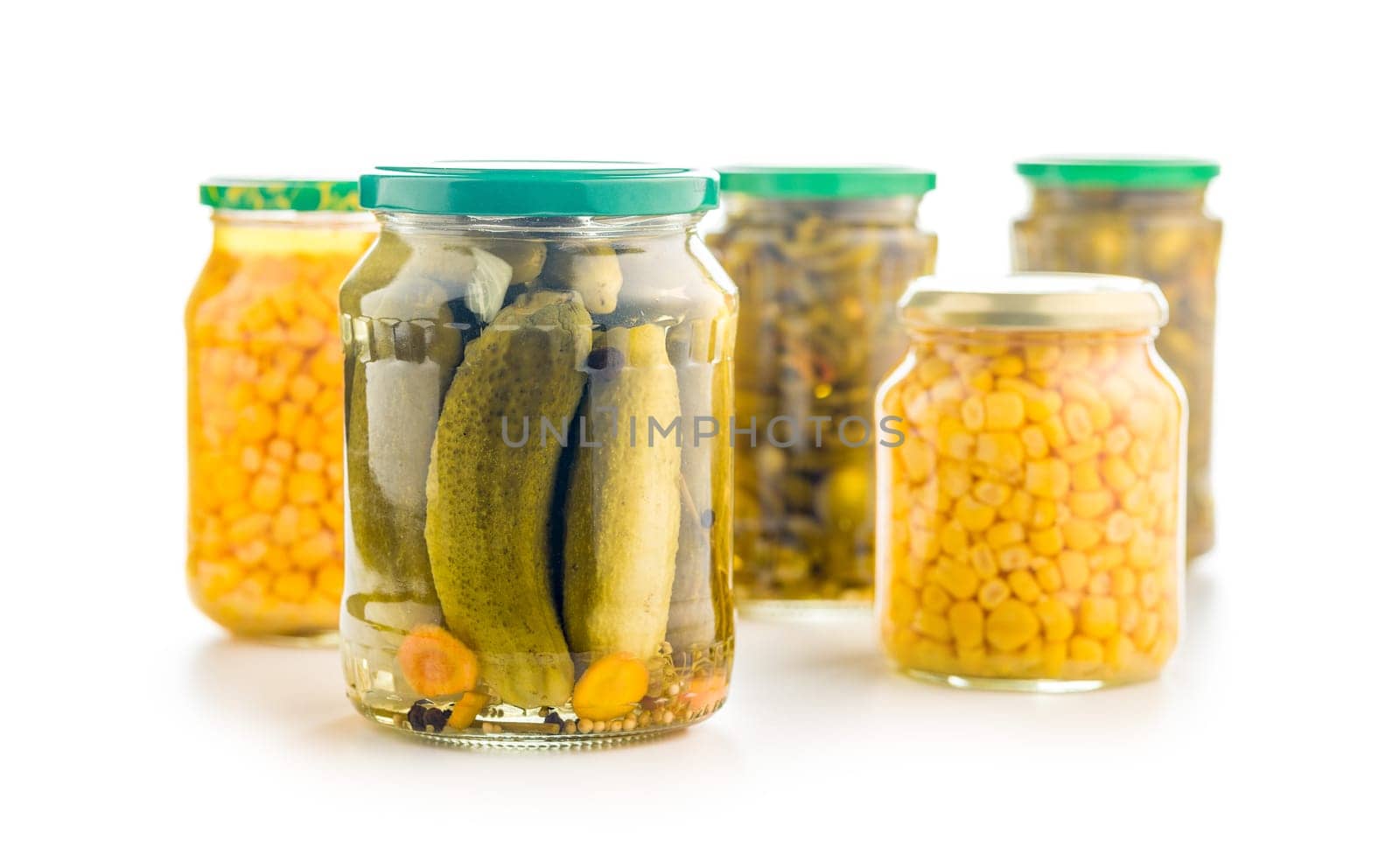 Pickles. Marinated cucumbers in jar isolated on a white background.
