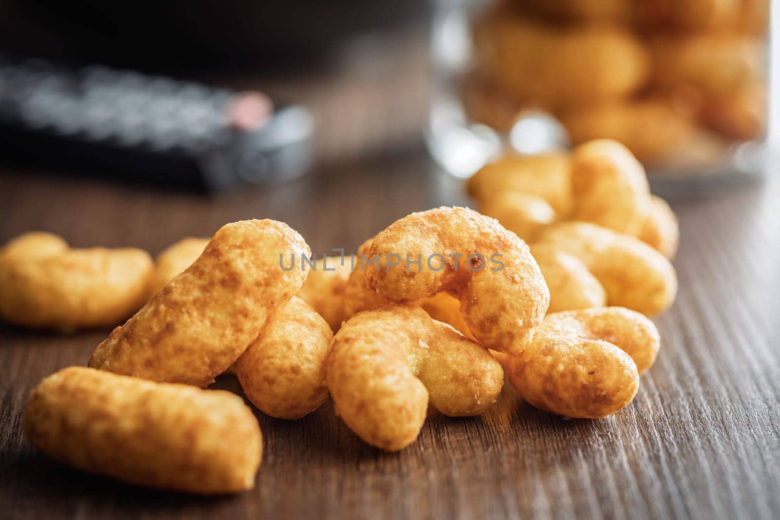 Puffed crispy Peanut flips on a wooden table.