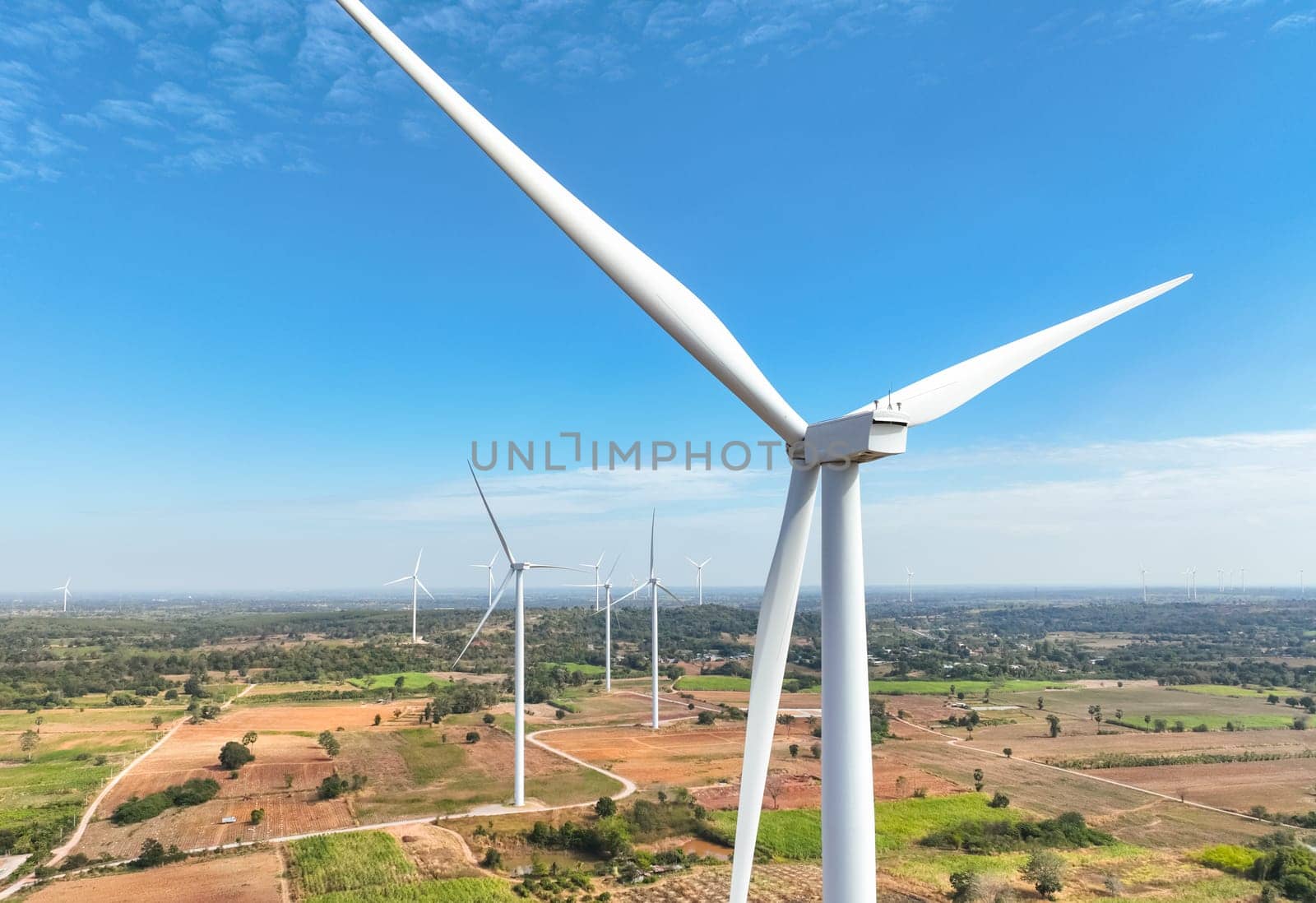 Wind energy and sustainable power generation with wind turbines, Eco-friendly solutions for renewable resources. Wind power farm and sustainable development of renewable energy, green technology.