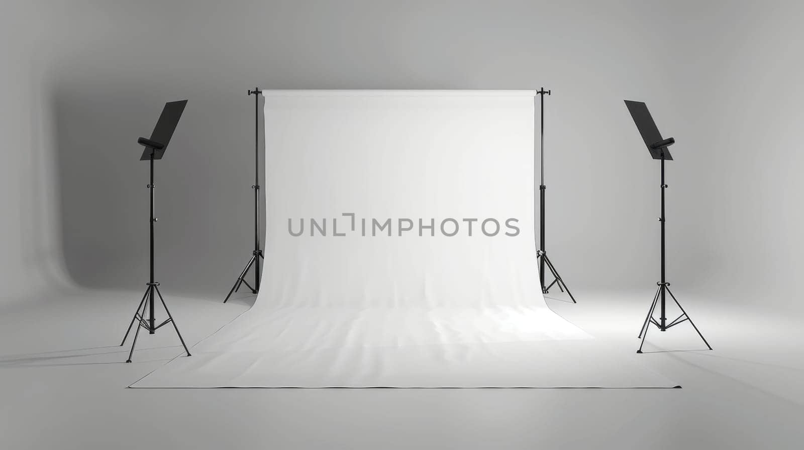 A white backdrop with three black tripods in front of it. The backdrop is empty and the scene is set in a studio