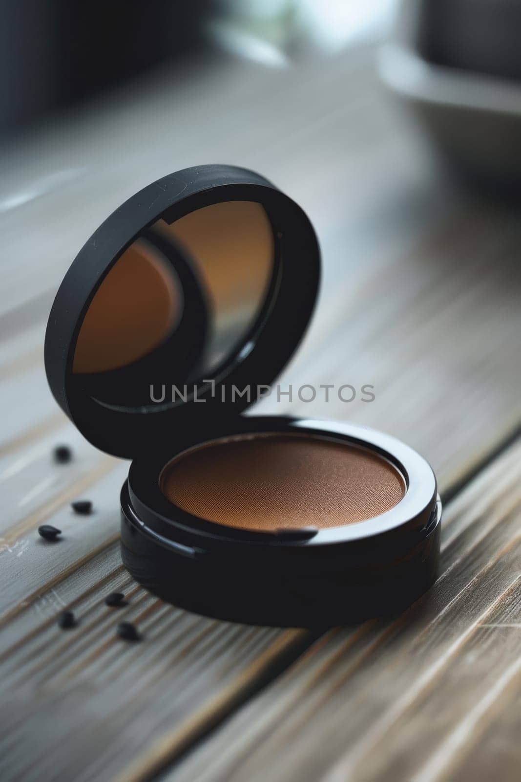 Chic silhouette of a makeup compact with sleek, minimalist design.