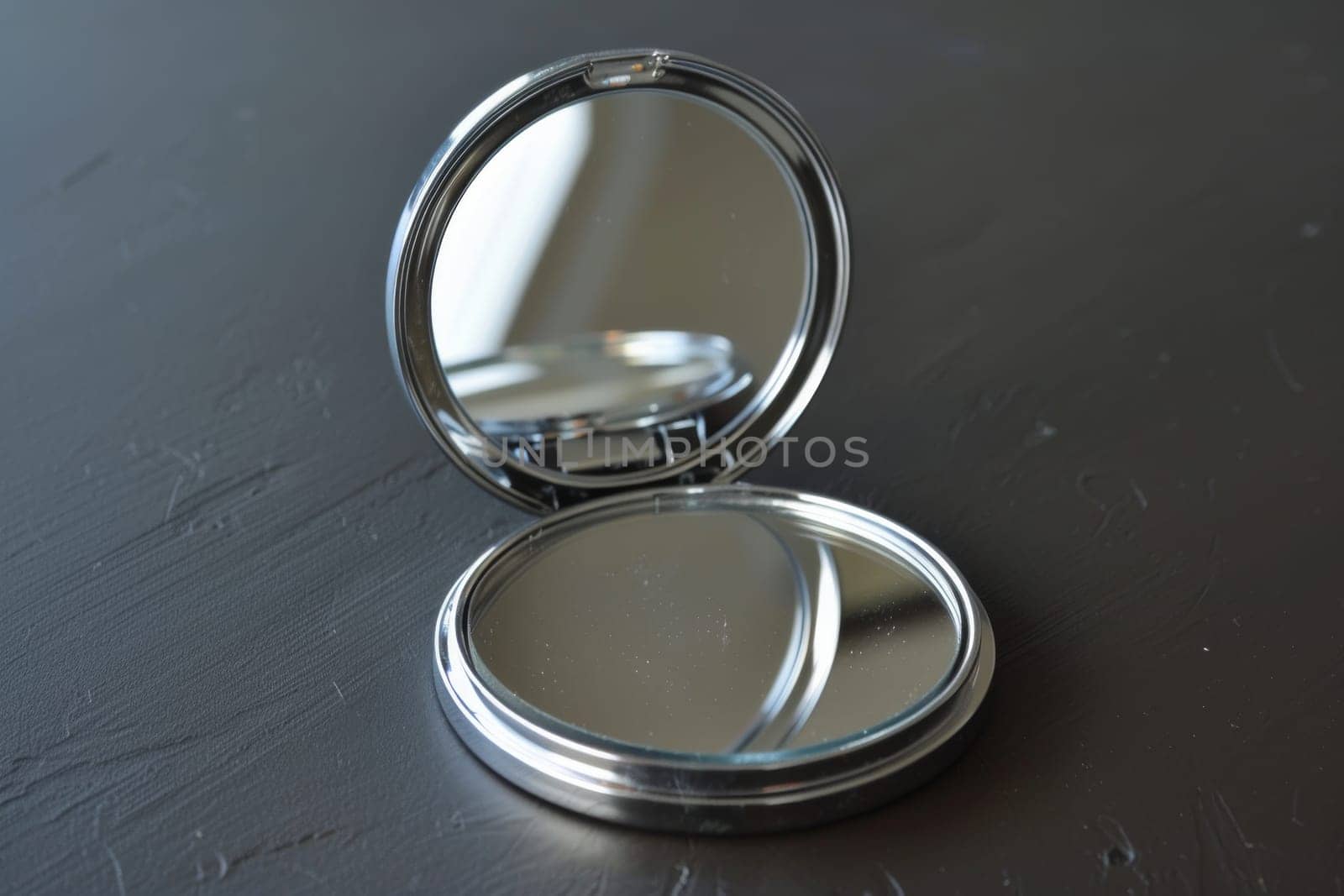 Compact mirror with a magnifying side for detailed application.