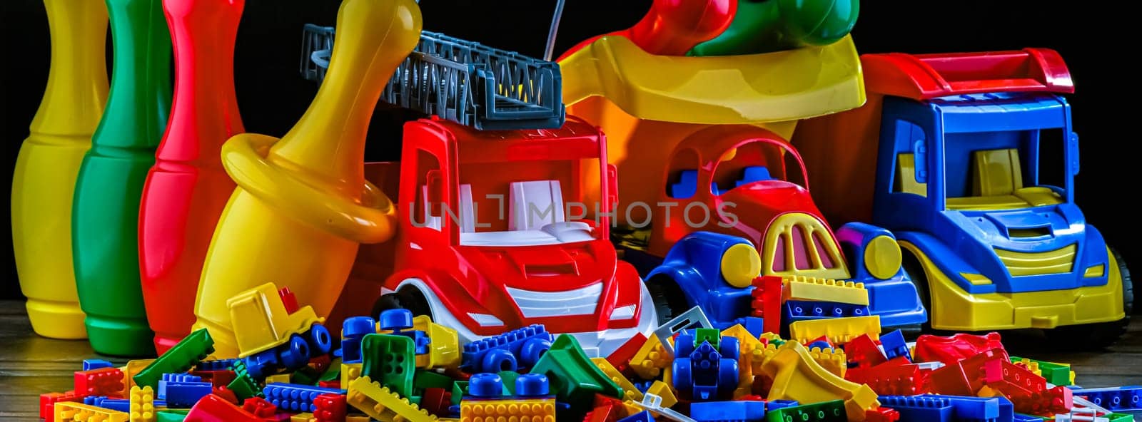 Composition with colorful plastic children toys.