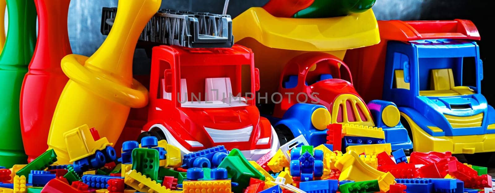 Composition with colorful plastic children toys.