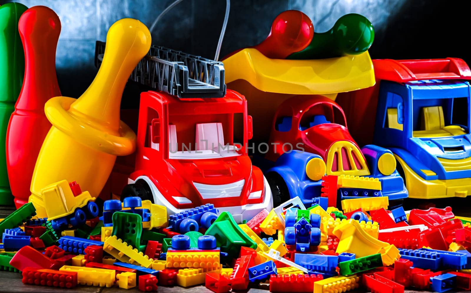 Composition with colorful plastic children toys.