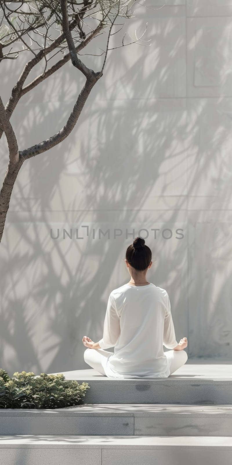 Simple and elegant scene of an ageless woman practicing mindfulness in a minimalist outdoor setting.